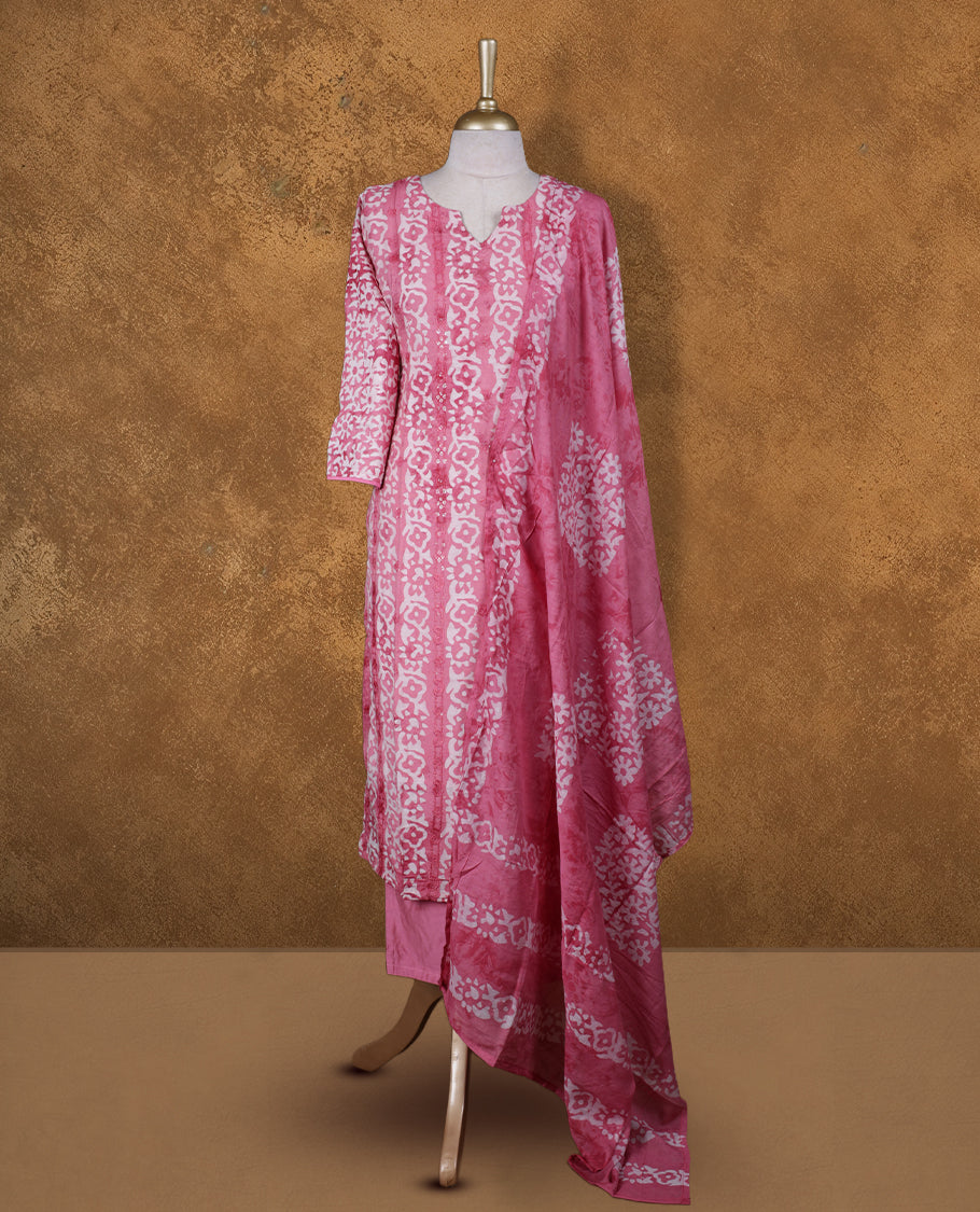 Pink and white colour churidar set featuring V neckline, sleeves, and White floral pattern across the body, Paired with a matching dupatta