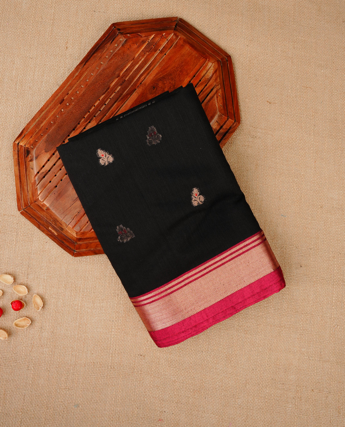 Black colour Maheshwari cotton saree, gold zari floral motifs on body, complement light pink colour gold zari border comes with matching blouse.