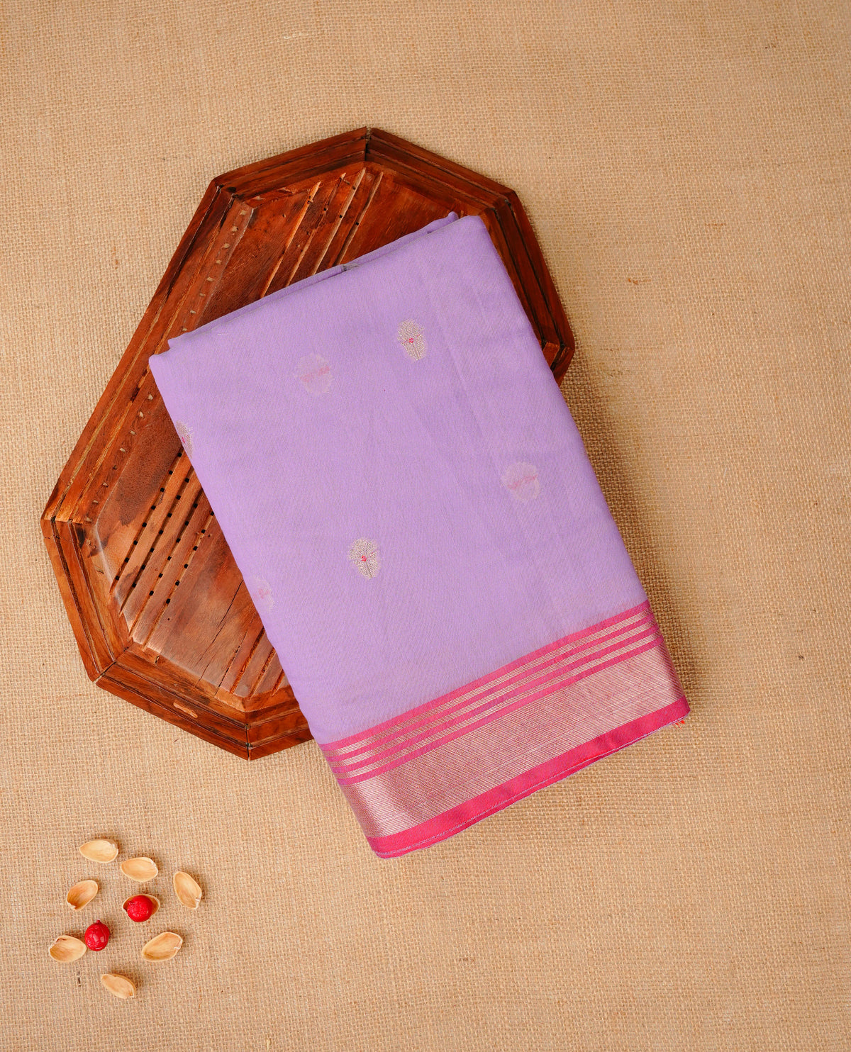 Lavender colour Maheshwari cotton saree, gold zari floral motifs on body, complement light pink colour gold zari border comes with matching blouse.