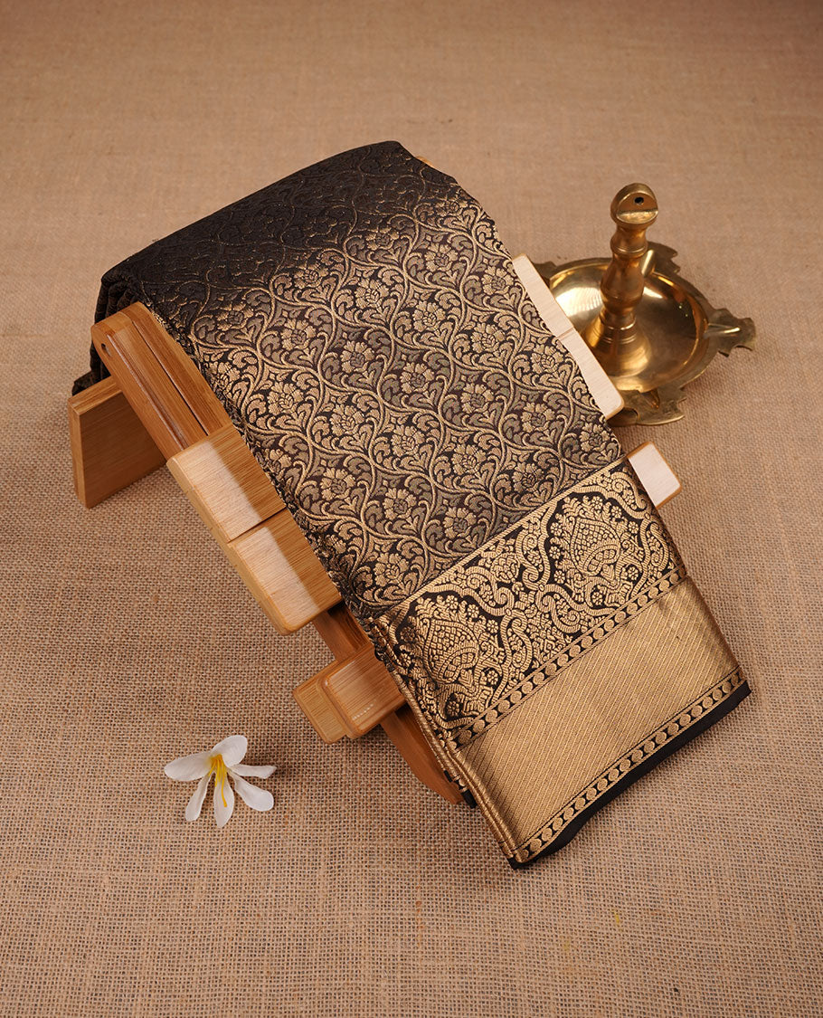 Dark coffee brown colour kancheepuram silk saree featuring antique gold zari jacquard on body with traditional border, paired with plain matching blouse piece.