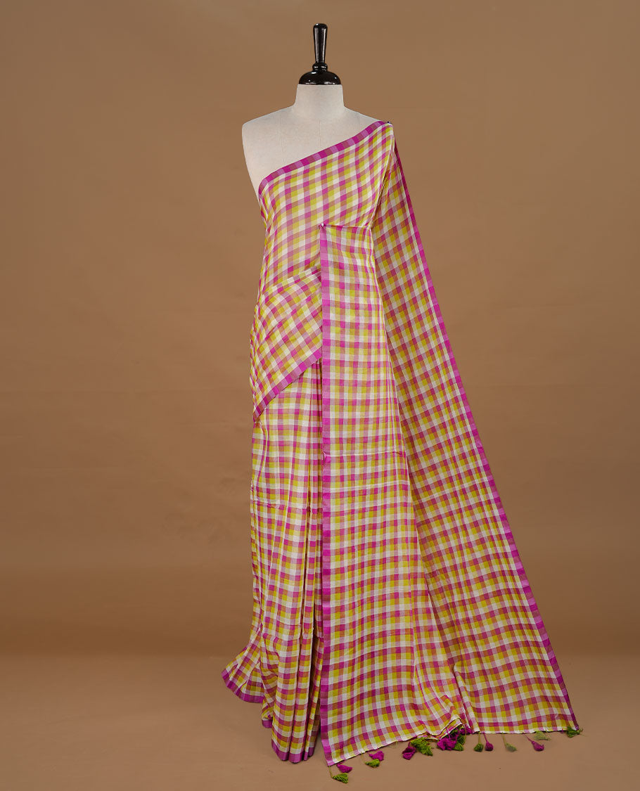 Green, Purple and White colour Mul Cotton saree featuring a classic Big check pattern on the body, accented with tassels for added charm. Comes without a blouse piece.
