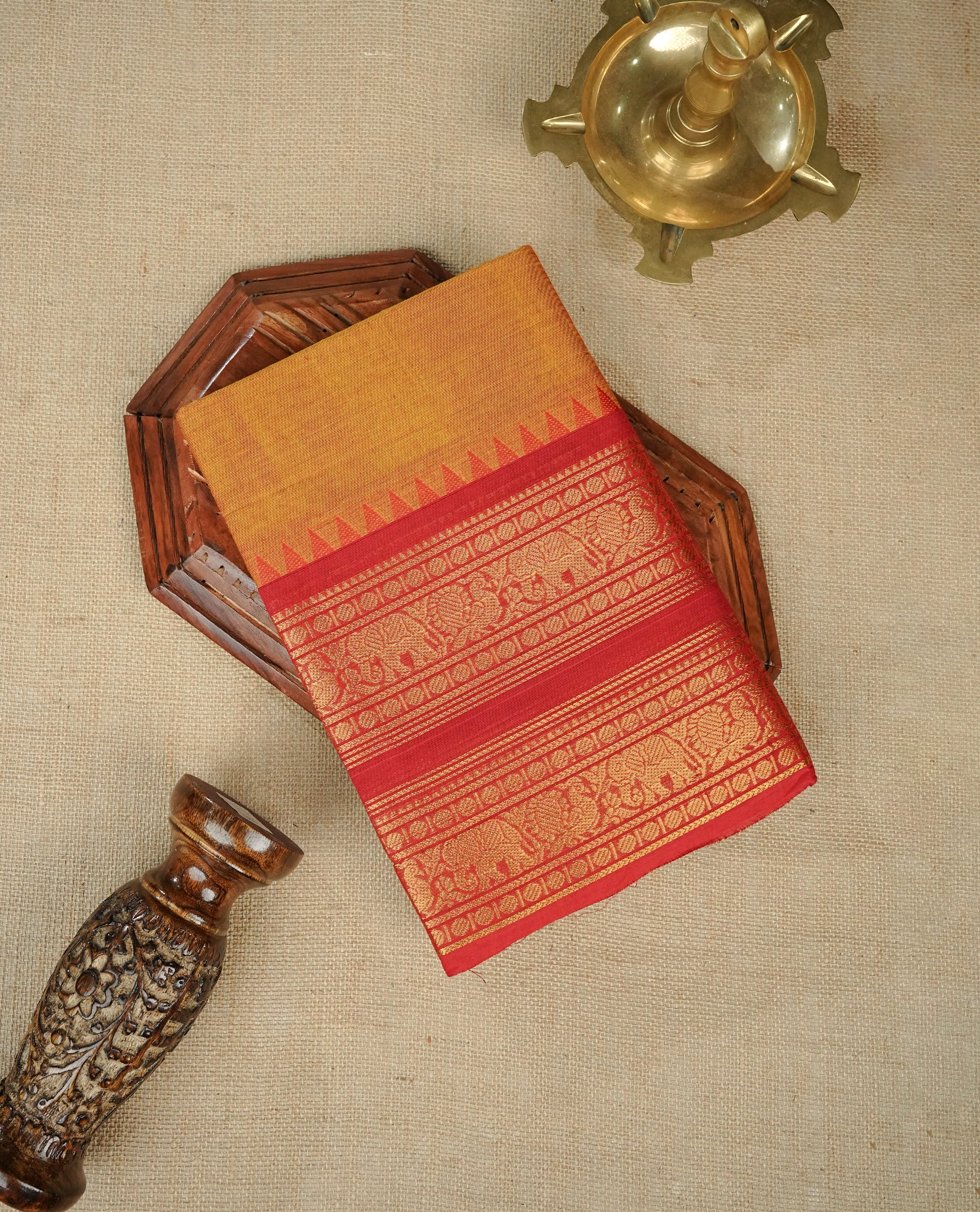 Mustard Yellow Colour Chettinad Cotton Saree Featuring a Plain Body, Complemented by a Red Colour with Grand Gold Zari Border and a Contrast Striped Pallu, Paired with a Matching Blouse Piece.