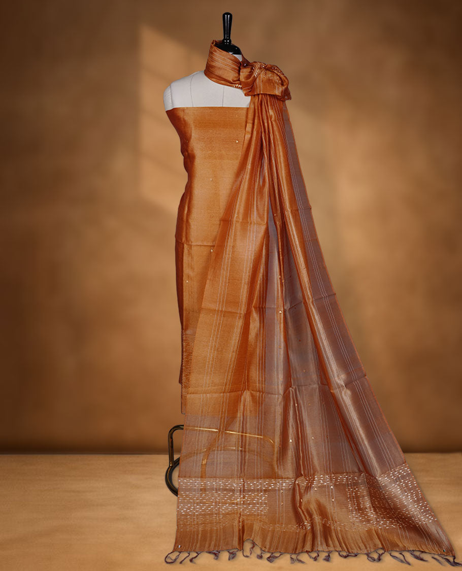 Mustard shade Tussar suit material with elegant thread detailing on the body, paired with a plain bottom and a worked Tussar dupatta.