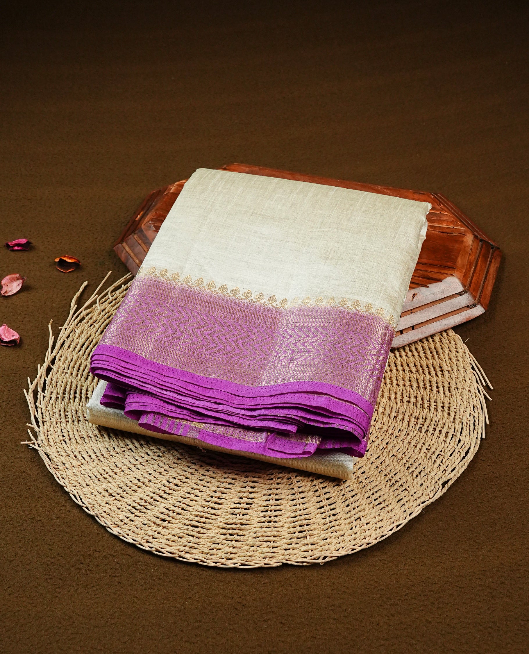 Off white Gold Tussar Saree Featuring elegant plain body, Complemented by contrast Purple colour with gold zari Border, comes with matching blouse piece.