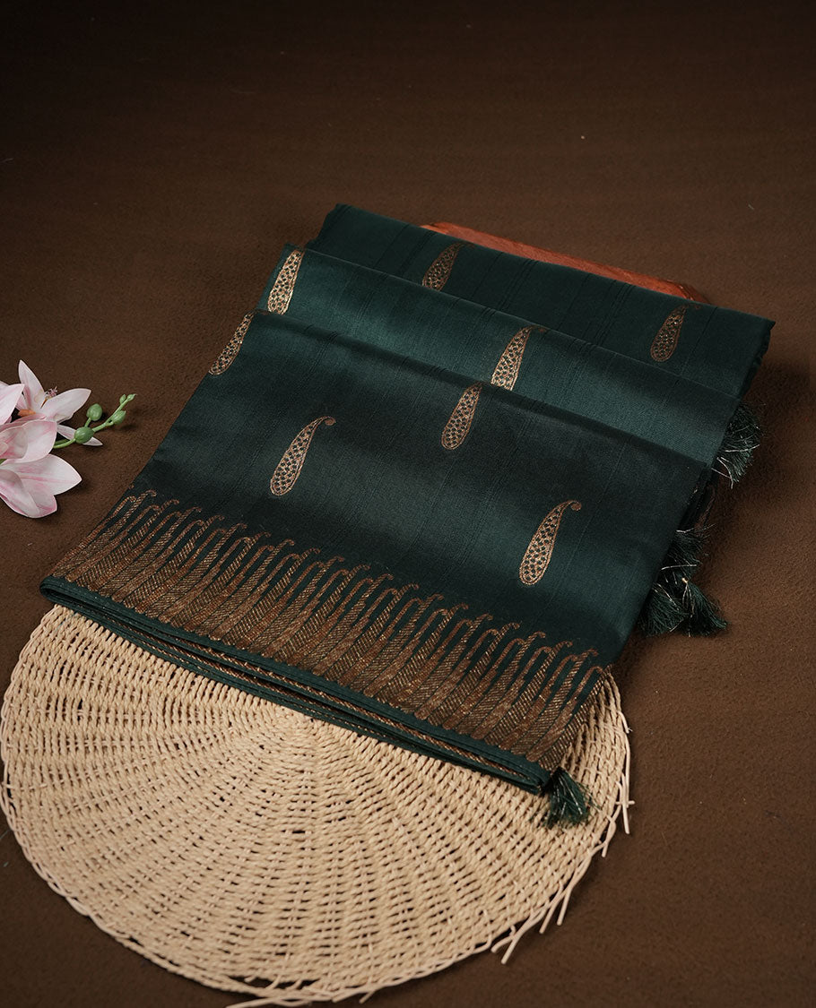 Dark green colour semi banaras tussar georgette featuring gold zari leaf pattern across body, finished with gold zari border and paired with matching blouse.