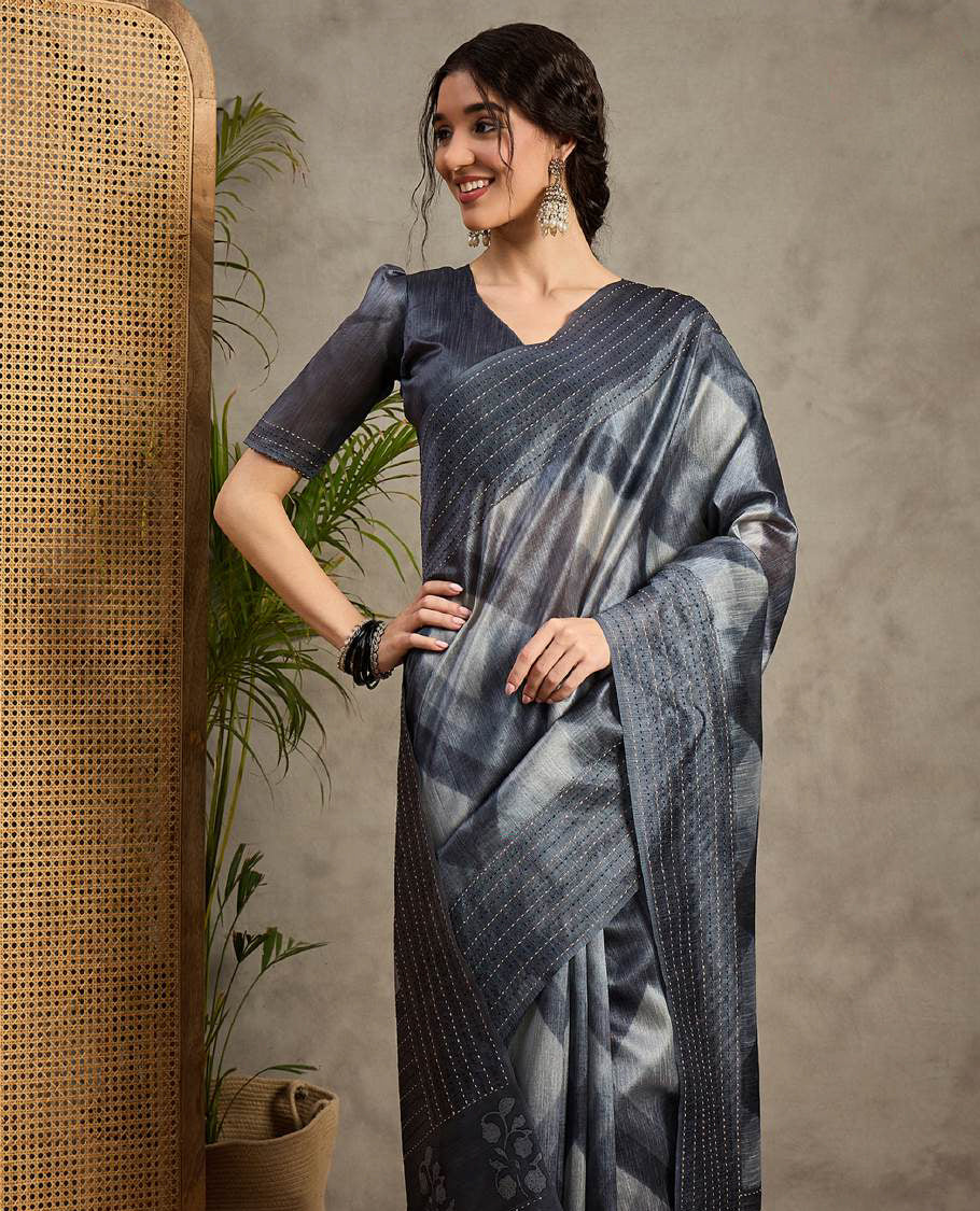 Dark Grey toned semi Tussar saree featuring contemporary fancy prints across the body, enhanced with a subtle Katha style stitched border, paired with a matching blouse for a stylish and elegant ethnic look.
