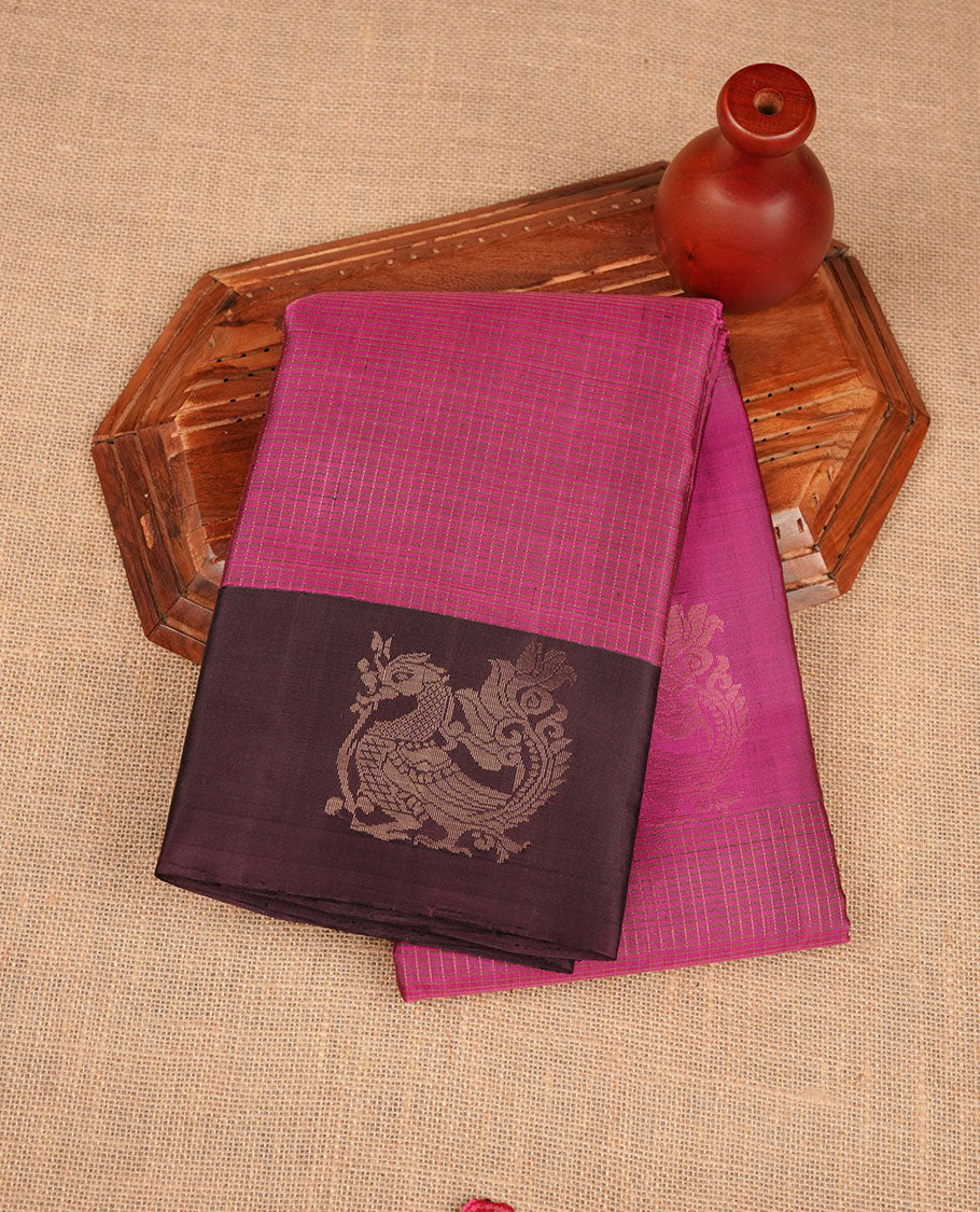 Pink colour soft silk saree featuring small zari check on body, complemented by contrast burgundy colour with peacock butta border, paired with matching blouse piece.