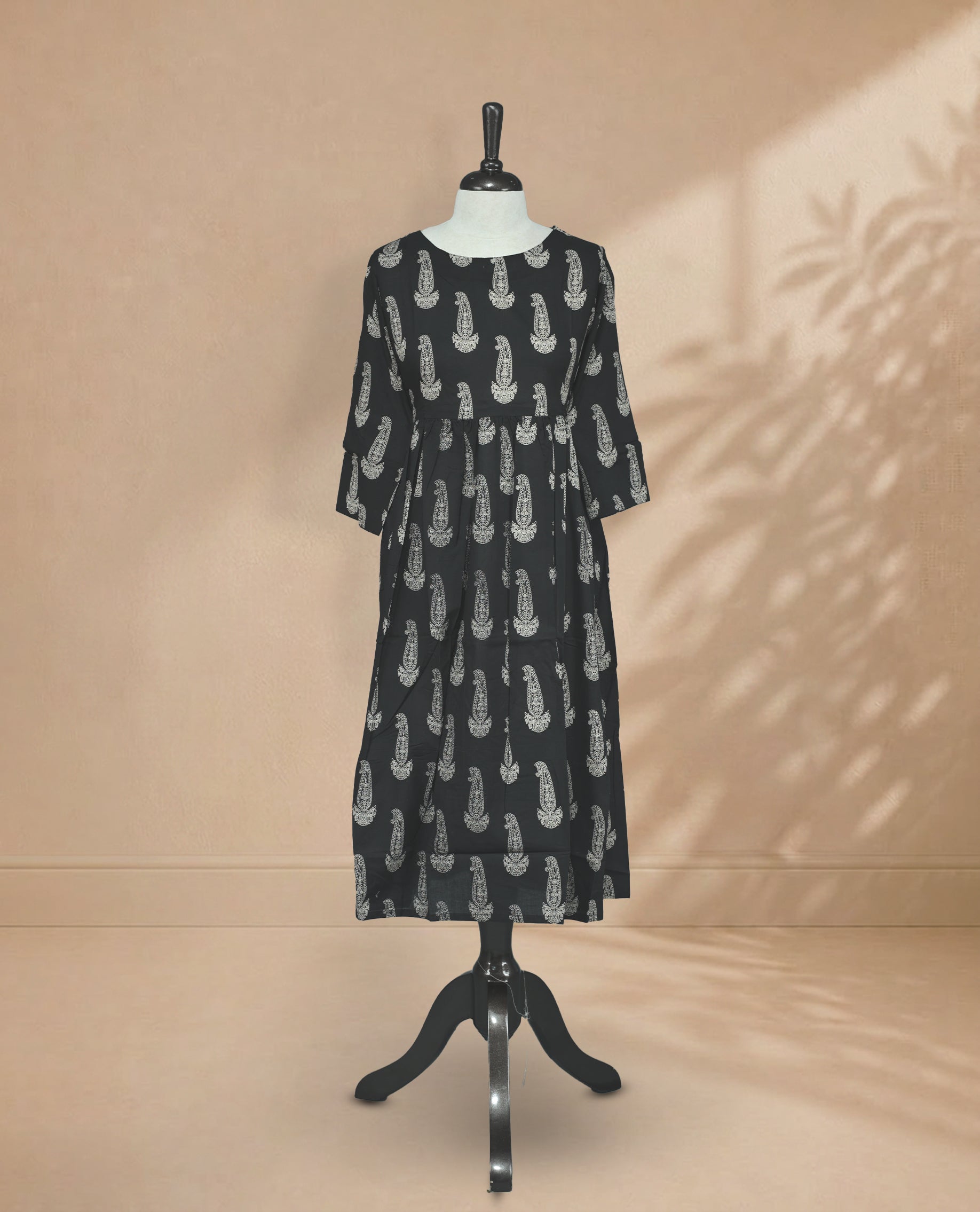 Black kurti featuring a classic U-shaped neckline, Cream Digital Prints on the body, sleeves.