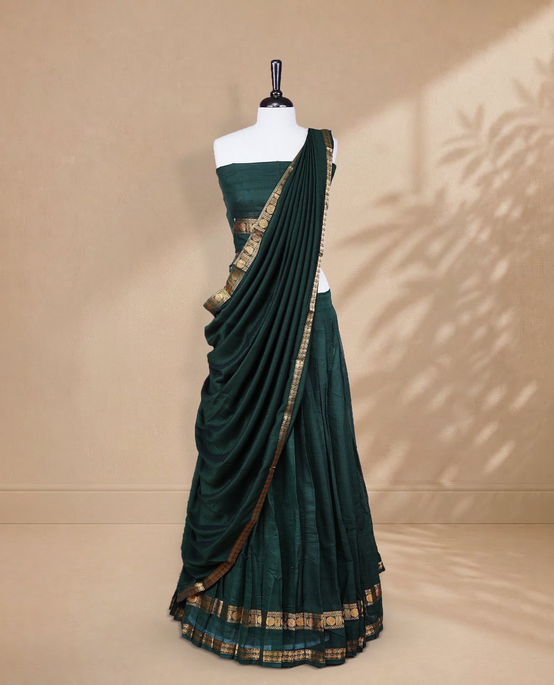 Bottle green colour Half saree featuring Plain skirt with Zari border on Self colour border, Unstitched Blouse and matching dupatta.