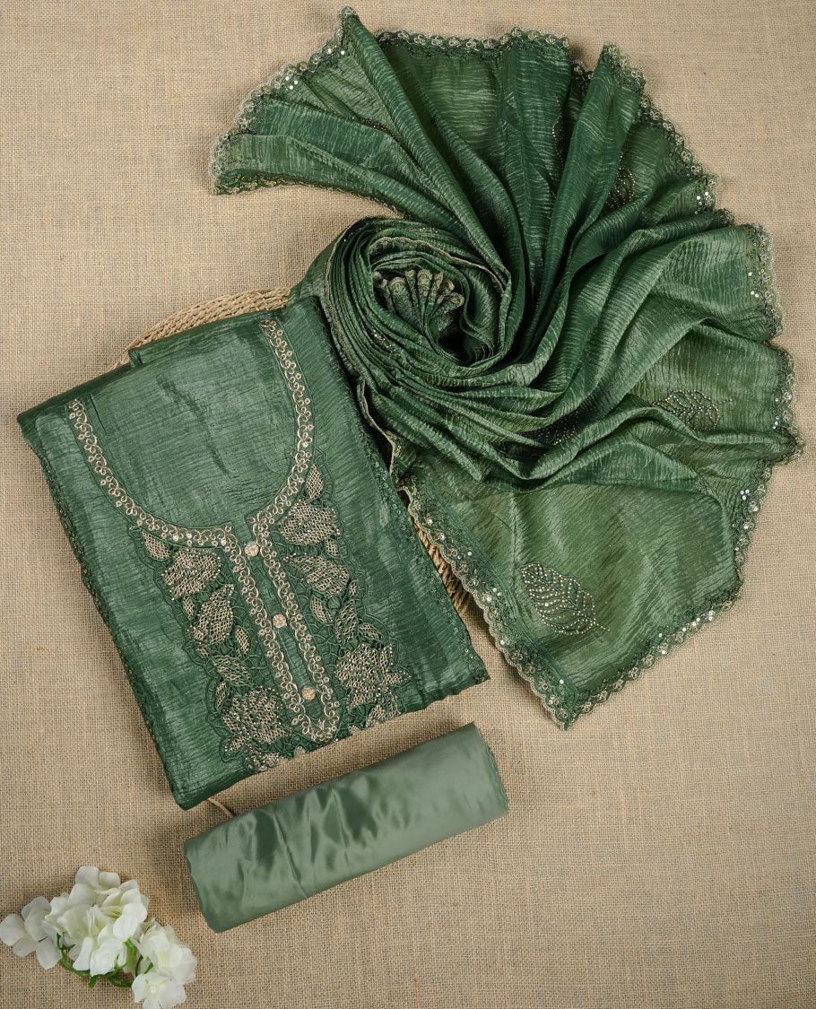 Deep green churidar suit material with delicate lace and sequin embroidery, paired with a textured matching dupatta and a plain coordinating bottom.