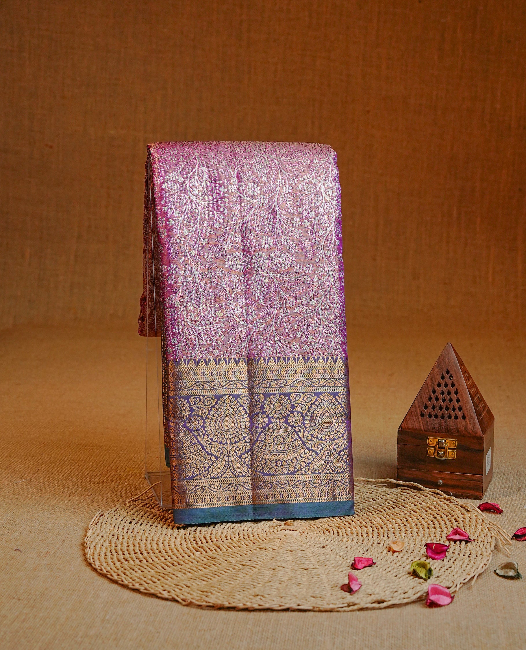 Gold & Purple colour Double shade Semi tissue silk saree featuring Silver Floral kodi pattern on body, Contrast Green colour with traditional border, paired with matching.