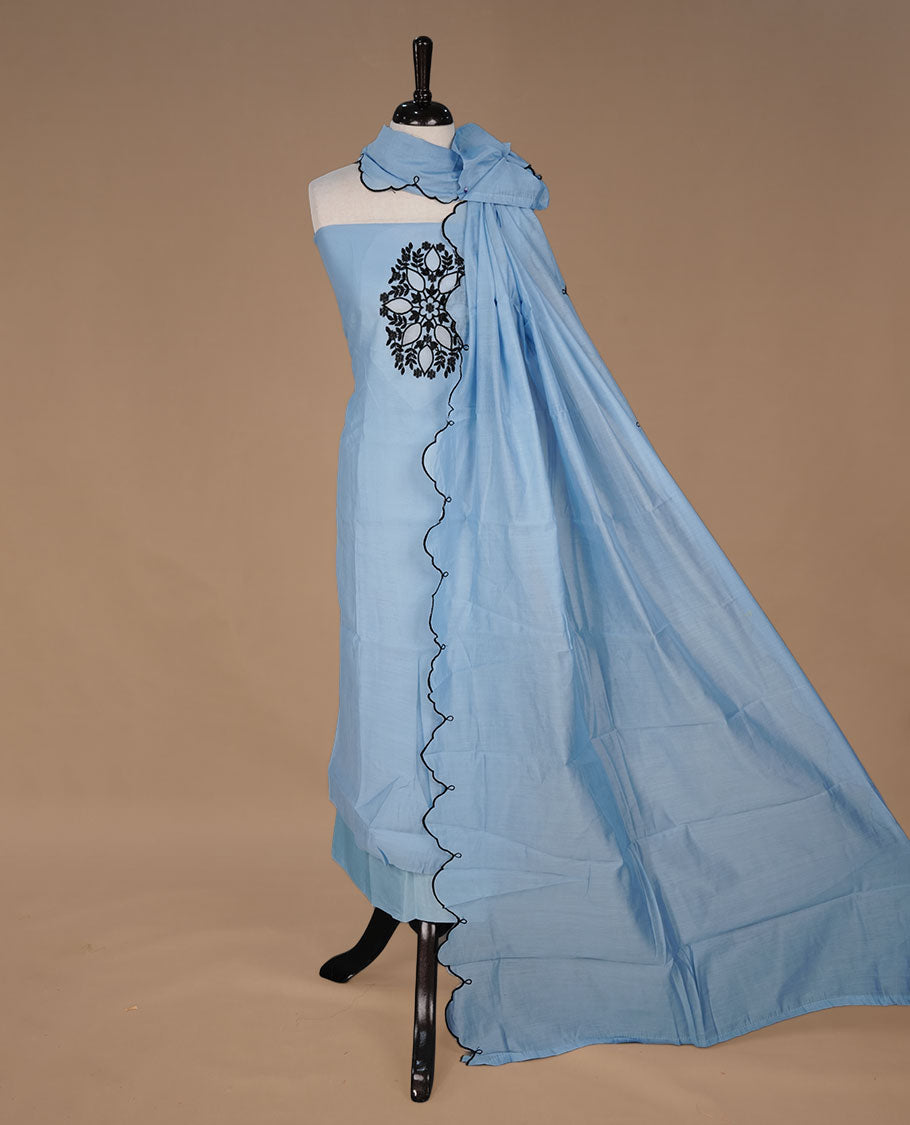 Sky blue colour churidar material featuring black thread pattern on body, paired with matching bottom and dupatta.