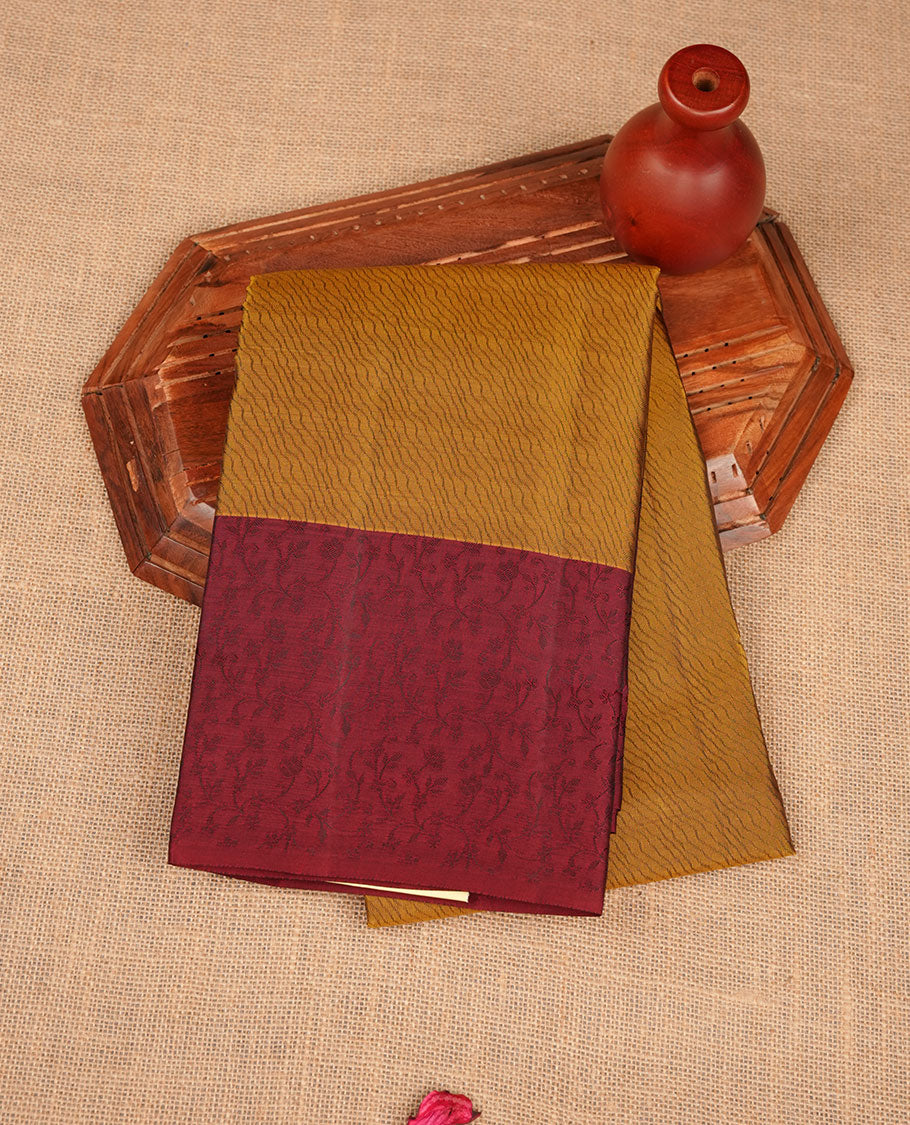 Fenugreek colour soft silk saree featuring self colour pattern on body, complemented by contrast maroon self colour pattern border, paired with matching blouse piece.