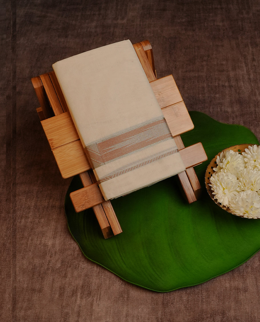 Cream Colour Cotton Double Dhoti Finished With A Classic Body ,Featuring Nude Brown Strips On Silver Zari Kara