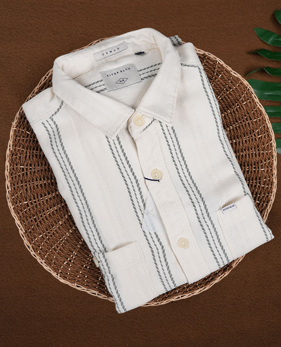 Cream colour shirt with pastel green vertical stripes, crafted in soft cotton for all day comfort, Featuring full sleeves, dual chest pockets, and a classic collar, it delivers a bold yet timeless casual style.