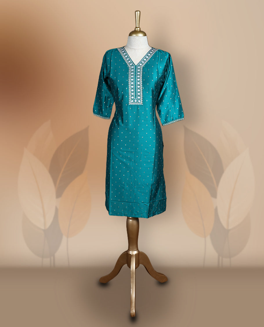 Peacock green colour kurti with delicate white embroidery and golden work on the neckline and sleeves, Features a stylish V-neck and 3/4th sleeves & ideal for casual outings or festive occasions.