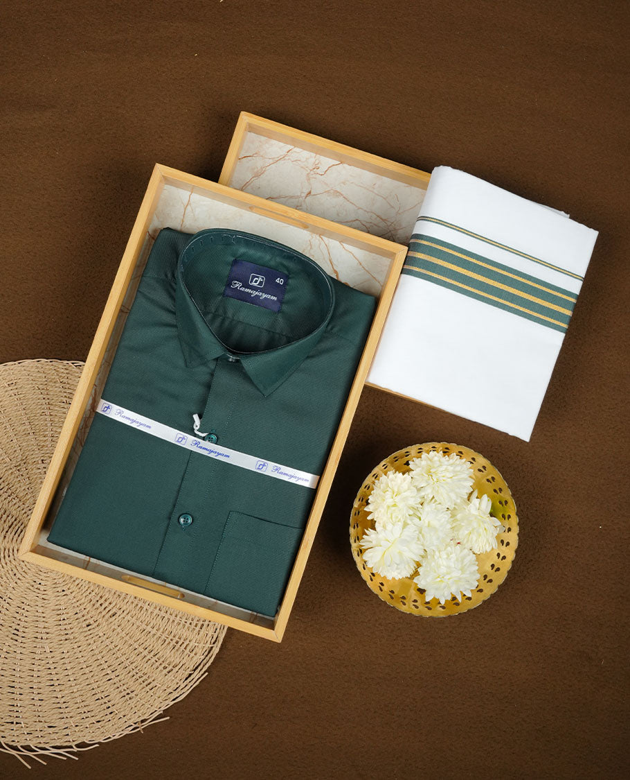 Dark green Colour shirt paired with a matching dhoti, finished with a dark green and gold border.