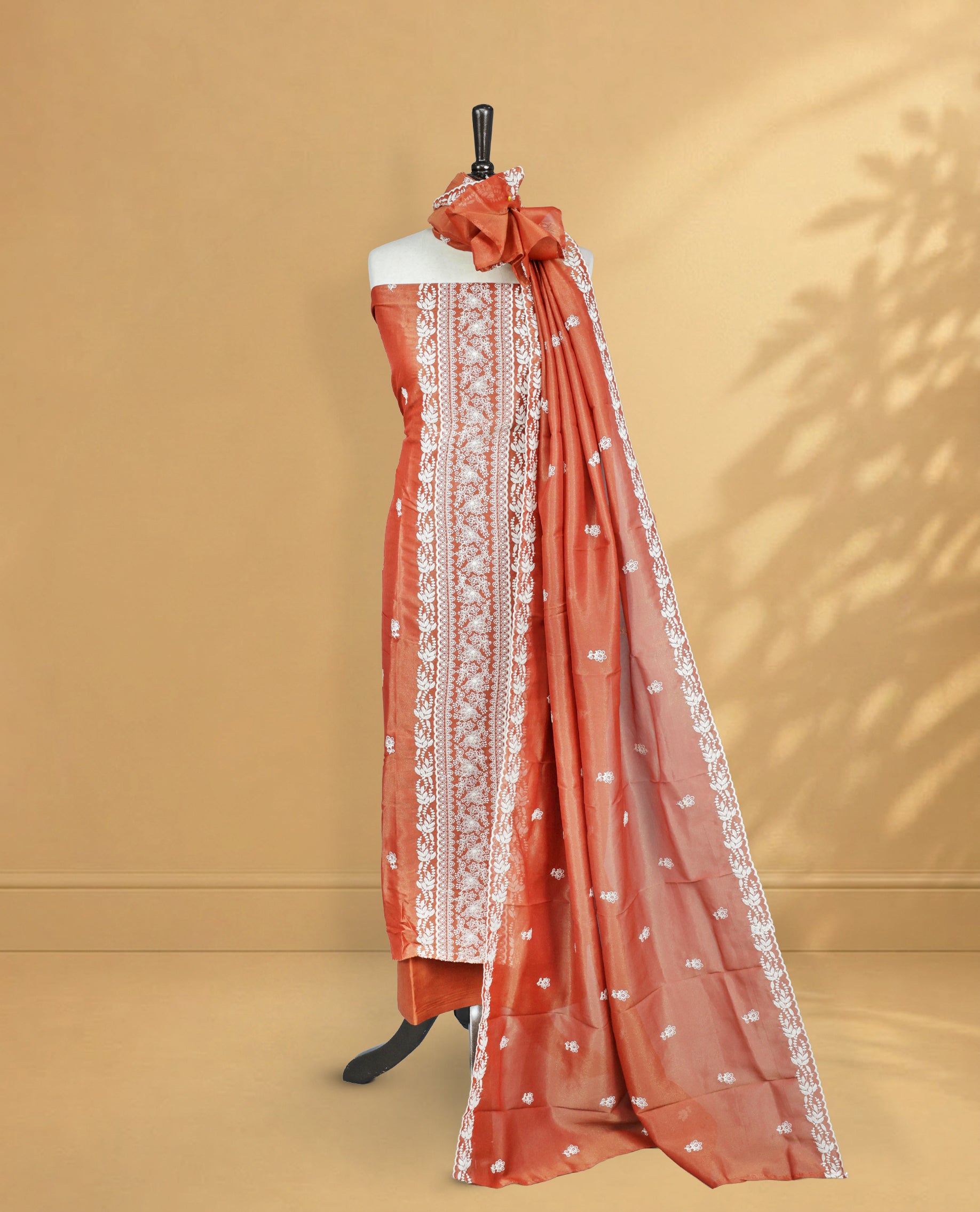 Rust Orange Colour Salwar Material Featuring Cream colour Thread Pattern on body, paired with Matching bottom & Elegant Dupatta.