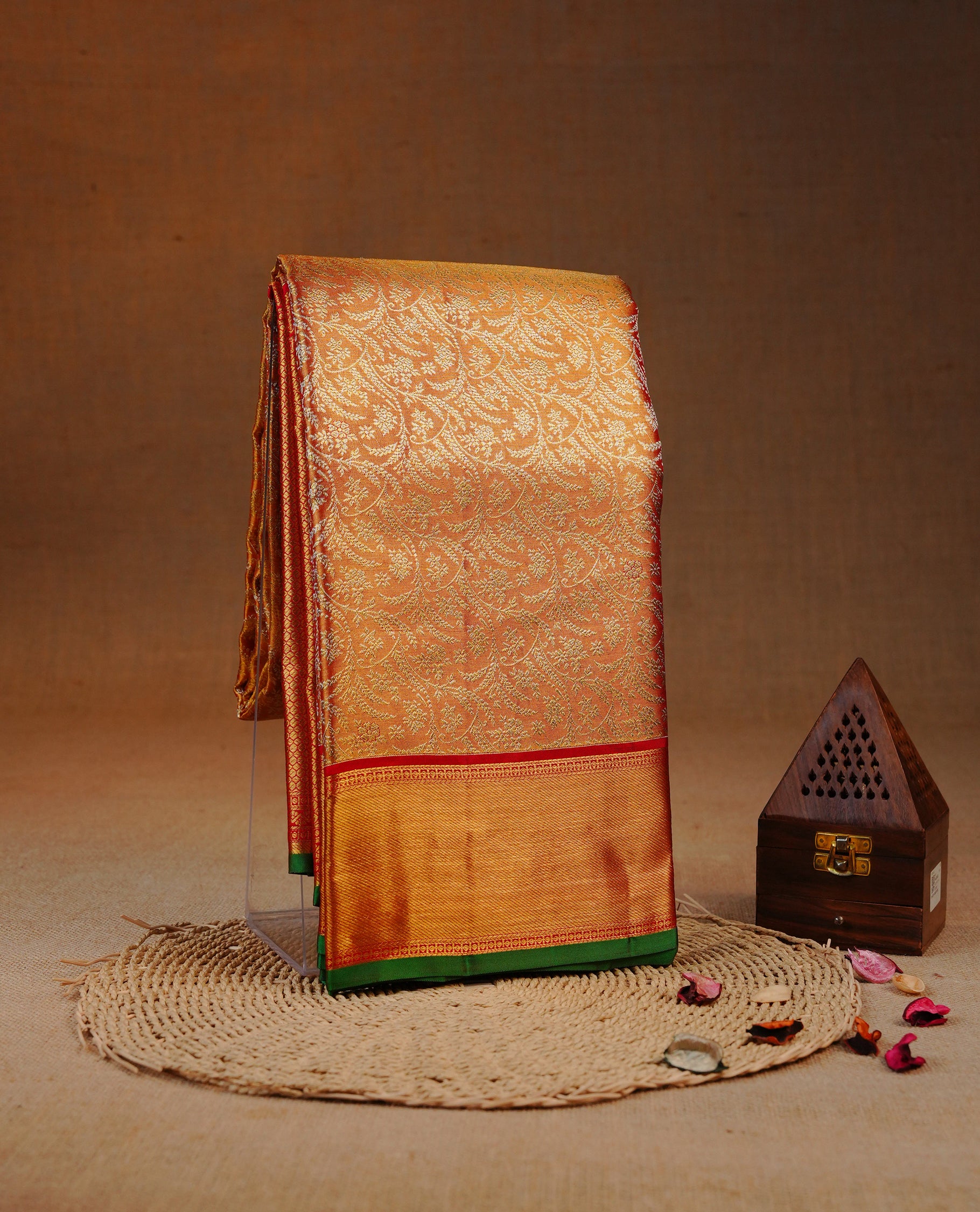 Red & Gold double shade colour Tissue silk saree featuring Silver Kodi pattern on body, complemented by Contrast Red & green With Gold Zari border, comes with matching blouse piece.