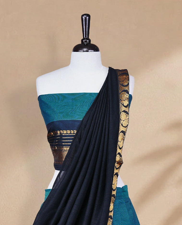 Teal colour Half saree featuring Plain skirt with Zari border on contrast black colour border, Unstitched Blouse and matching dupatta.