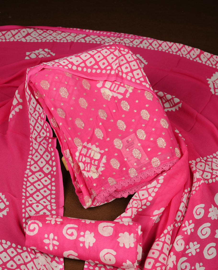 Pink colour churidar material featuring elegant gold butta work on the front panel, paired with a printed dupatta and matching bottom.