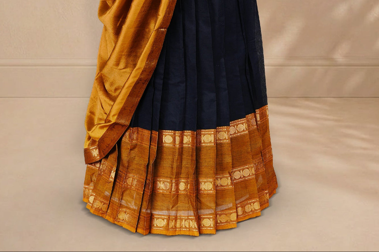 Black colour Half saree featuring Plain skirt with Zari border on contrast Mustard colour border, Unstitched Blouse and matching dupatta.