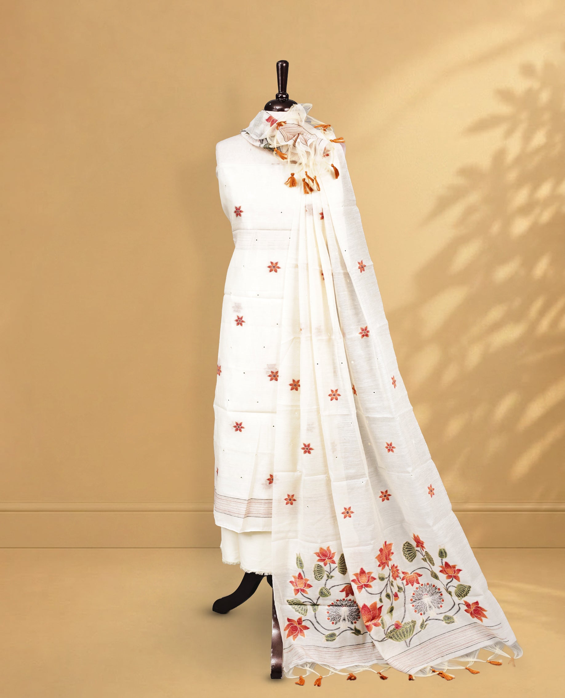 Off white Salwar material Featuring Motifs on body, zari border, paired with matching bottom, Floral Patterned Dupatta.