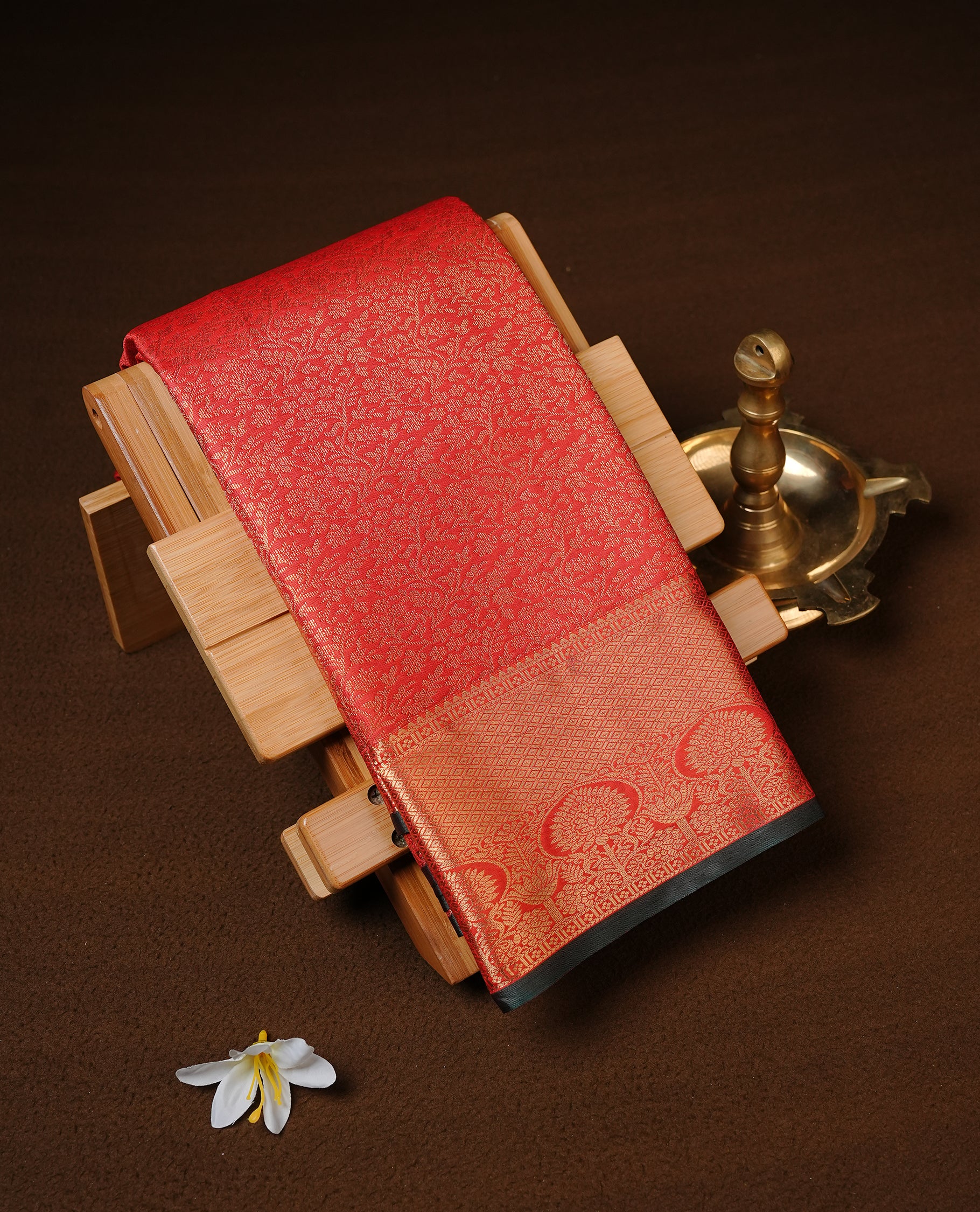 Red Colour Semi Wedding Silk Saree Featuring Gold Zari Floral Kodi Pattern, Showcased with self colour With Traditional Border, Paired With Matching Blouse Piece.