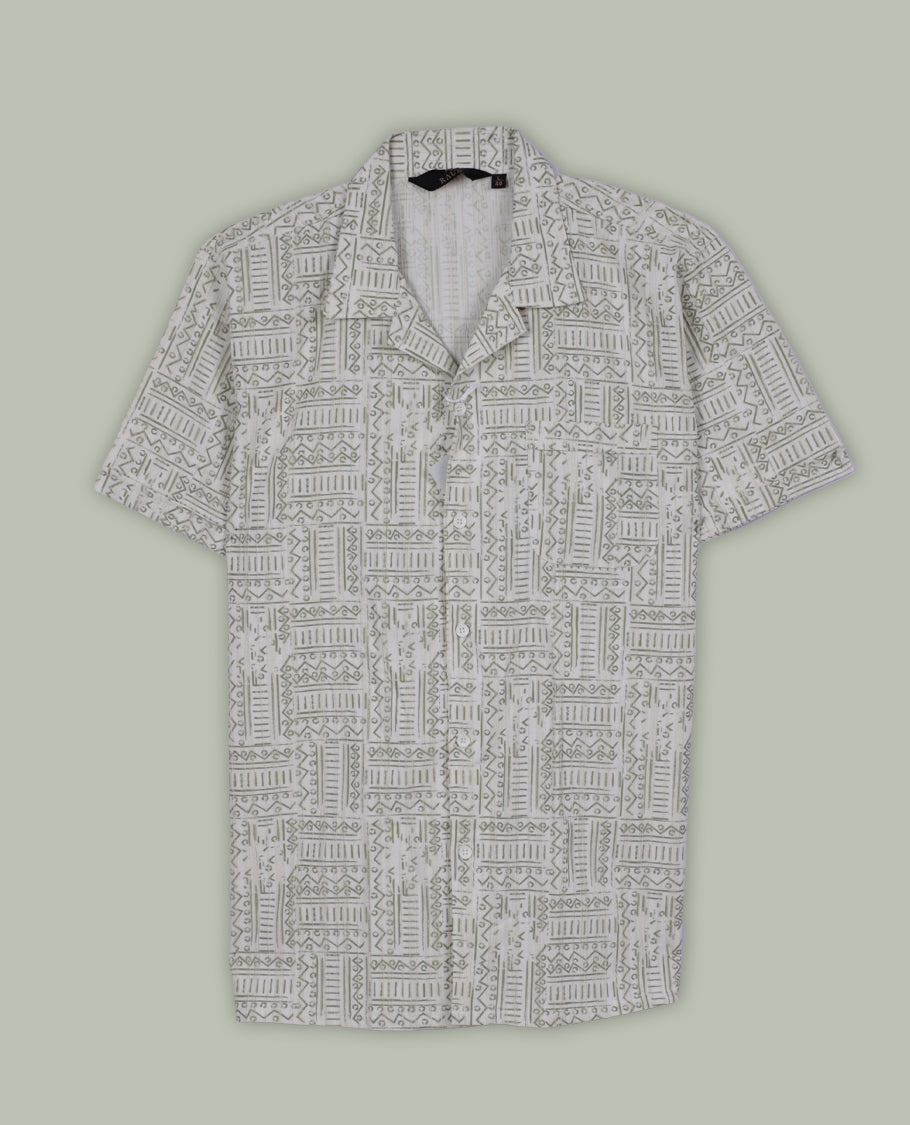 Off white colour shirt adorned with green geometric prints, Designed with a classic collar and full sleeves, it blends effortless style with everyday comfort.