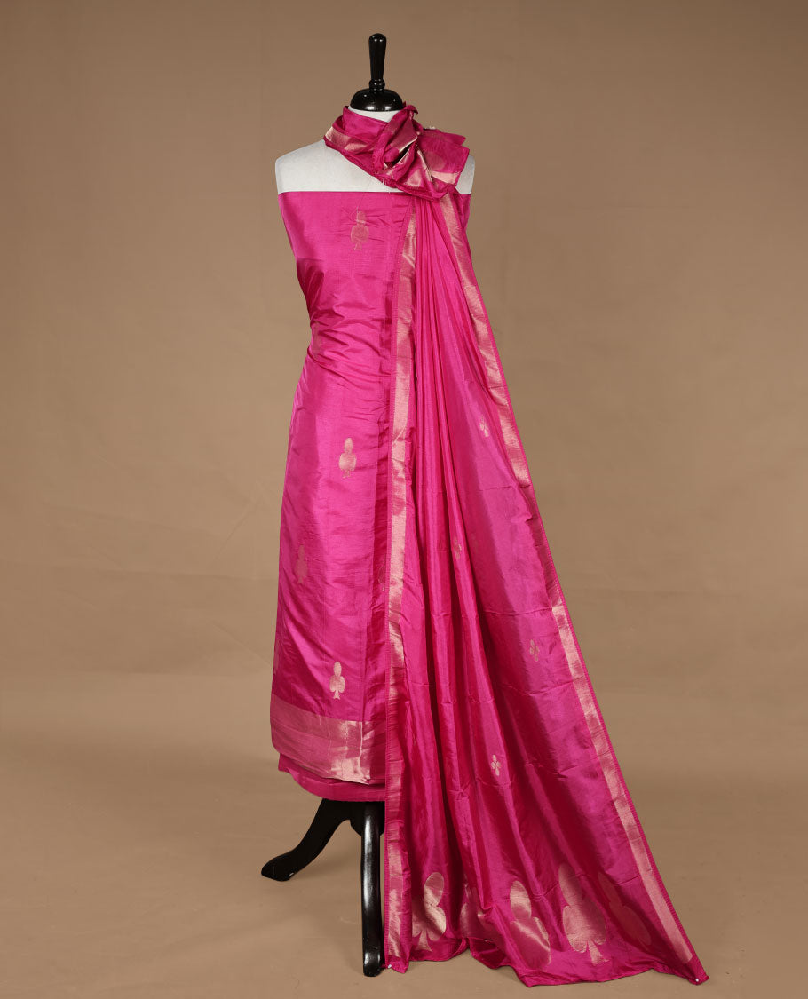 Pink colour churidar material featuring gold zari card pattern on body, border, paired with matching bottom and dupatta.