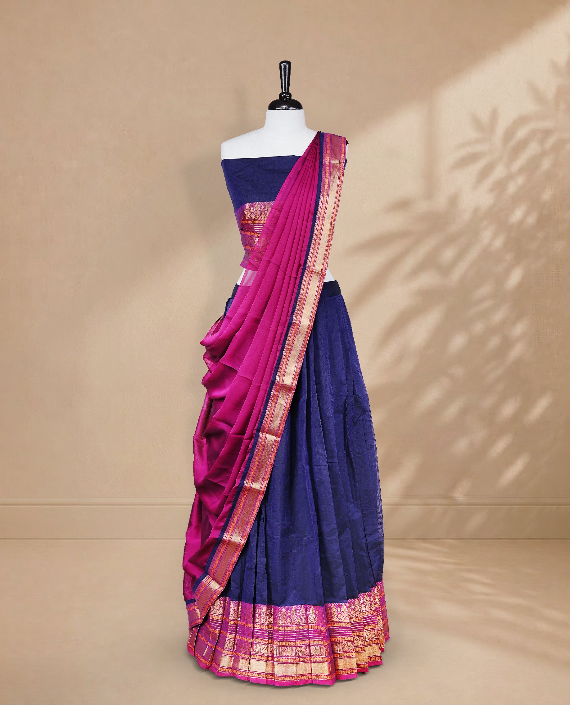 Navy Blue colour Half saree featuring Plain skirt with Zari border on contrast Magenta colour border, Unstitched Blouse and matching dupatta.