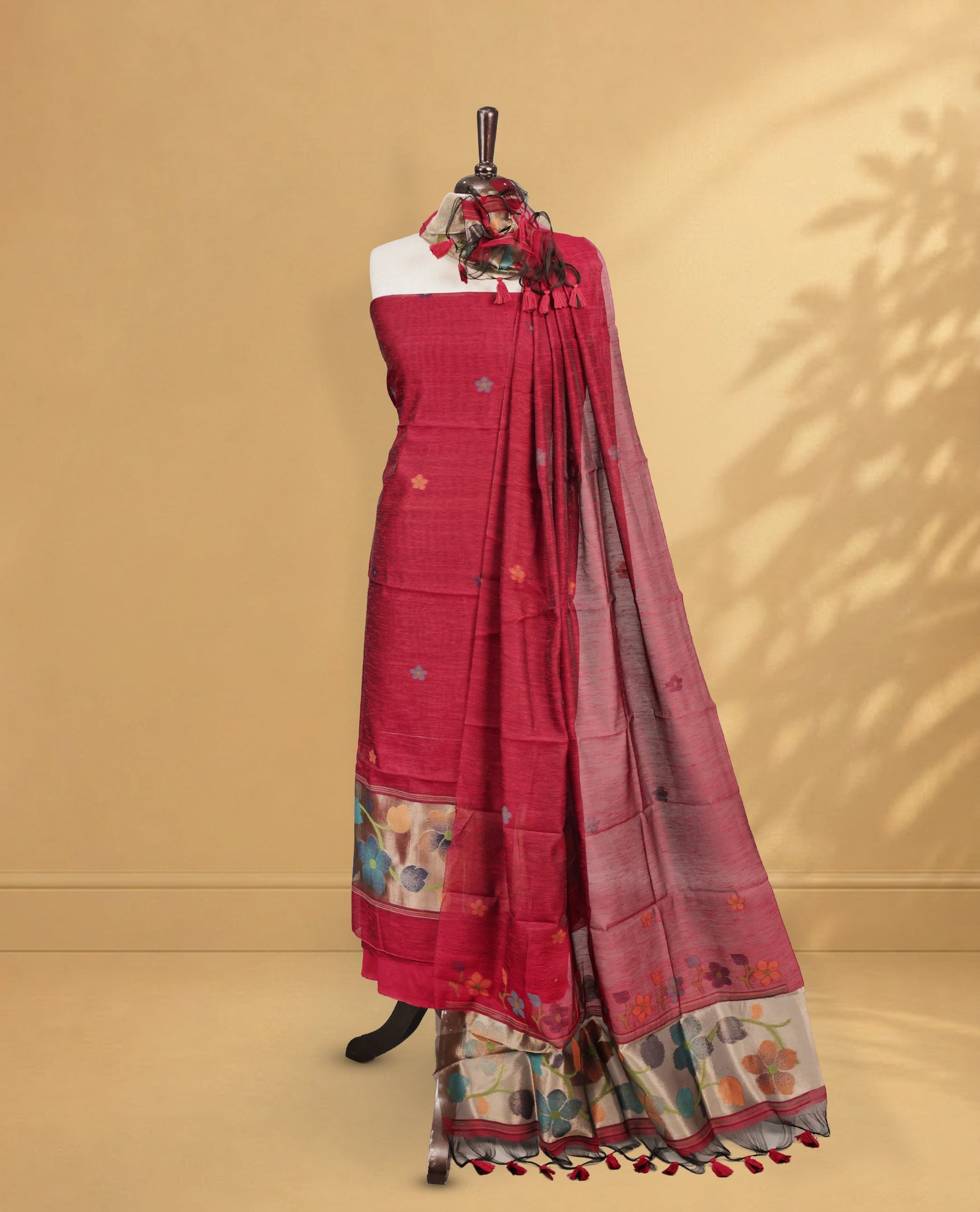 Maroon Colour Salwar material Featuring floral buttas & zari work on body, paired with Matching Bottom and same Patterned Dupatta.