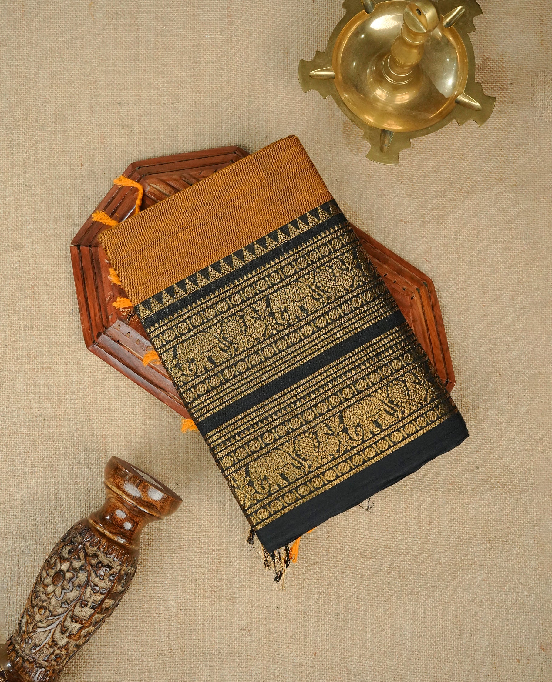 Mustard colour chettinad cotton saree Featuring Elegant plain body, complemented by contrast black colour with zari border, comes with matching blouse piece.