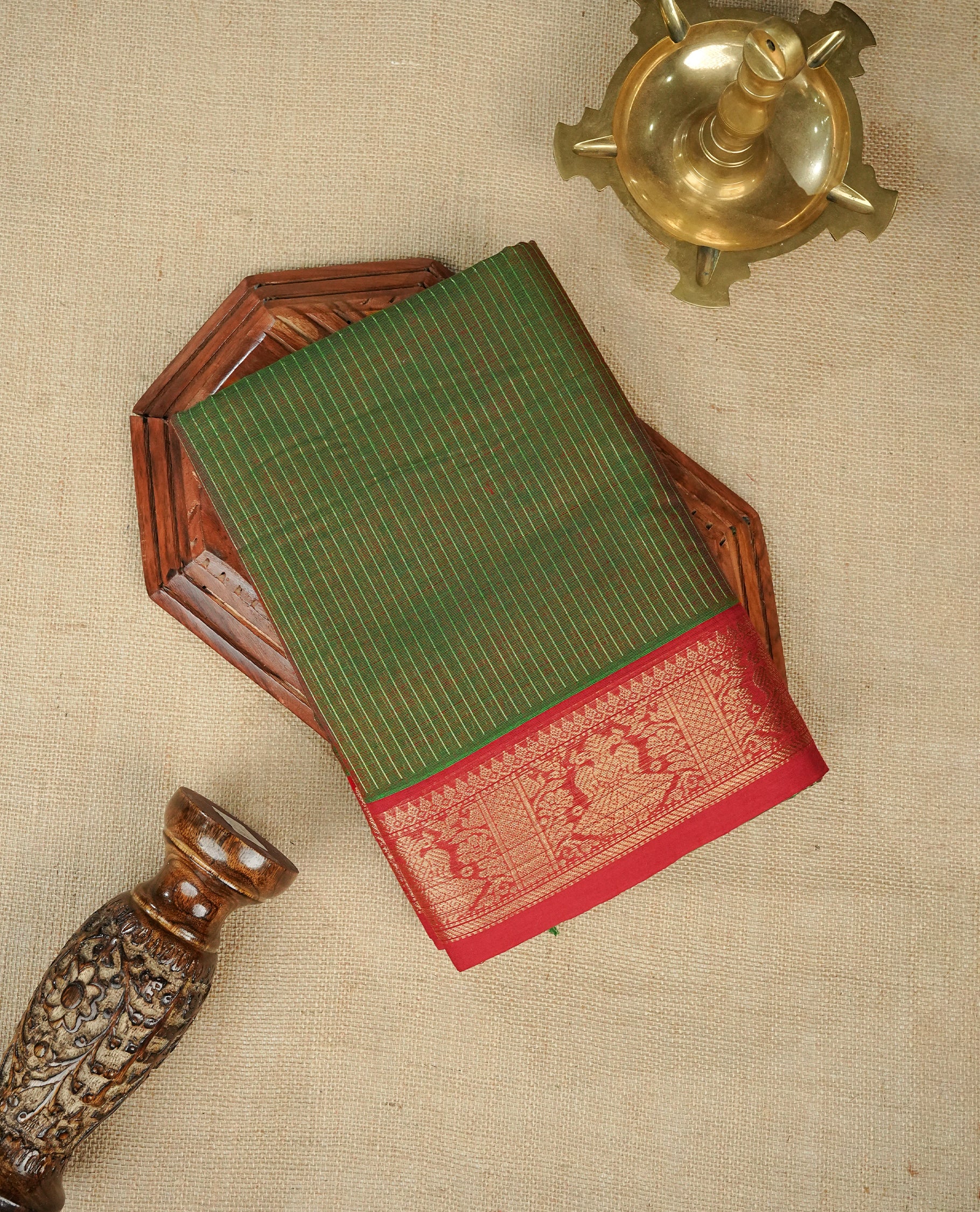 Green colour chettinad cotton saree featuring gold zari strips body, Contrast Maroon colour with Gold zari border, comes with matching blouse piece.