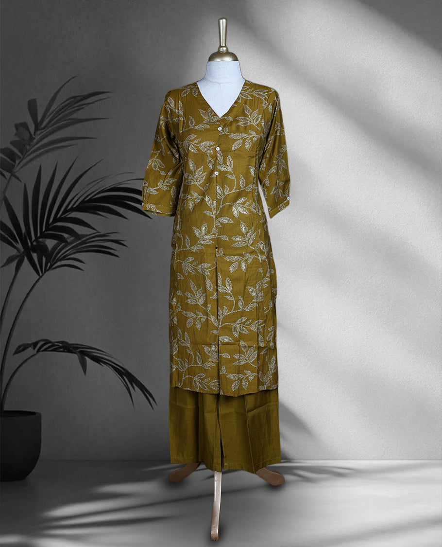 Mustard yellow colour cord set with elegant leaf motifs, featuring a V neck top with button detailing and matching straight fit pants.