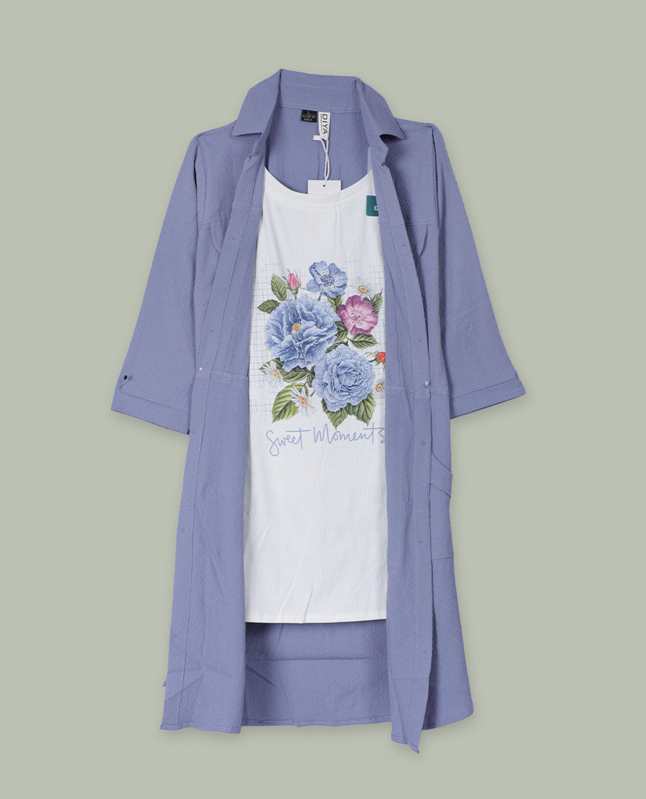 Periwinkle blue open-front shrug with collared neckline and three-quarter sleeves, layered over a white floral graphic tank top.