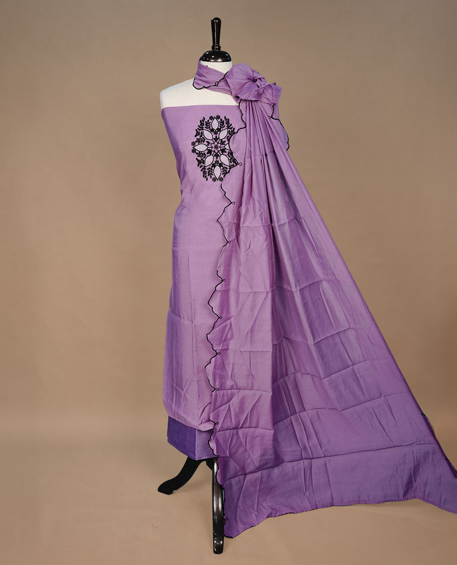Pastel purple colour churidari material featuring black thread pattern on body, paired with matching bottom and dupatta