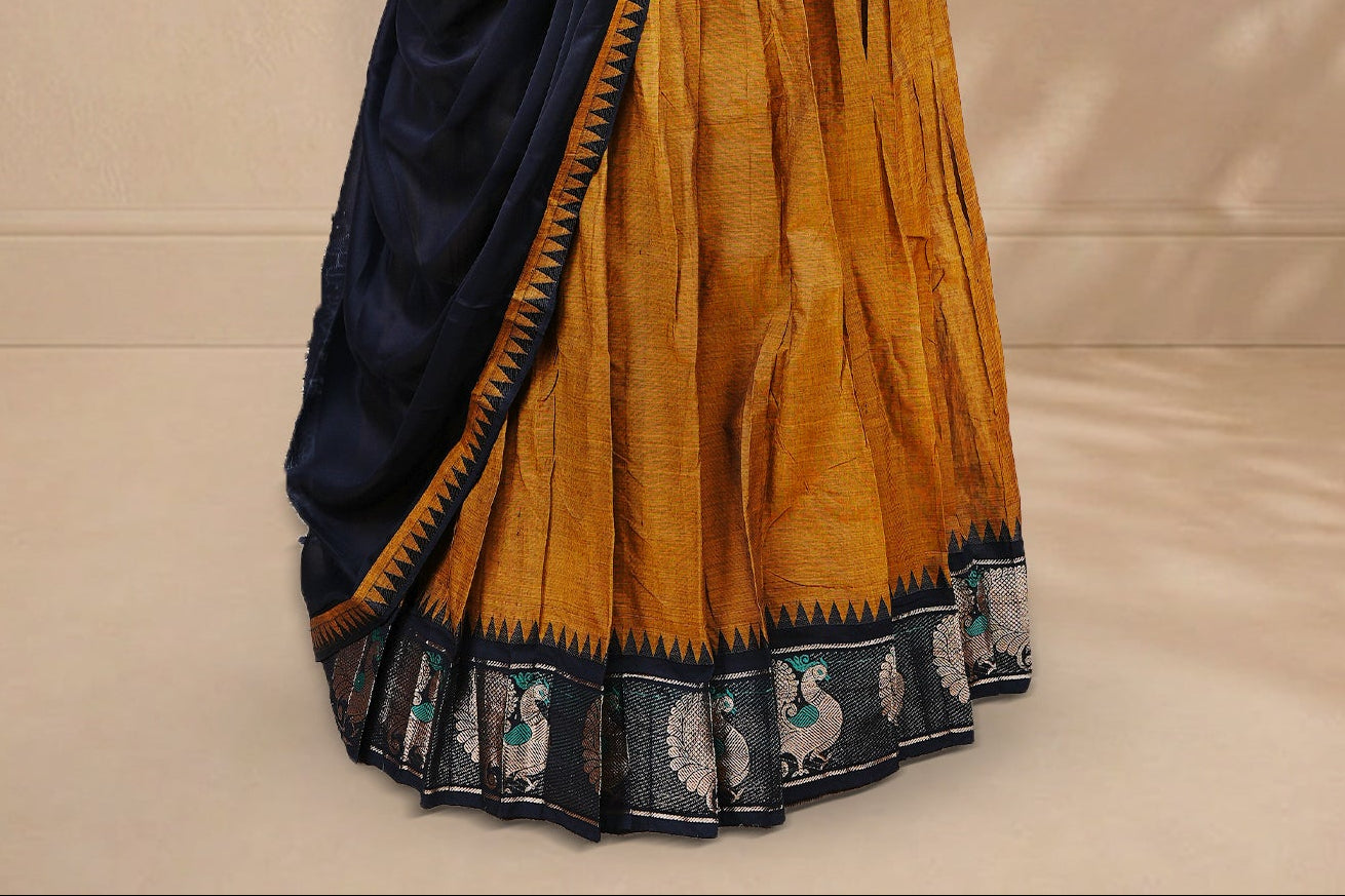 Mustard colour Half saree featuring Plain skirt with Zari border on contrast black colour border, Unstitched Blouse and matching dupatta.