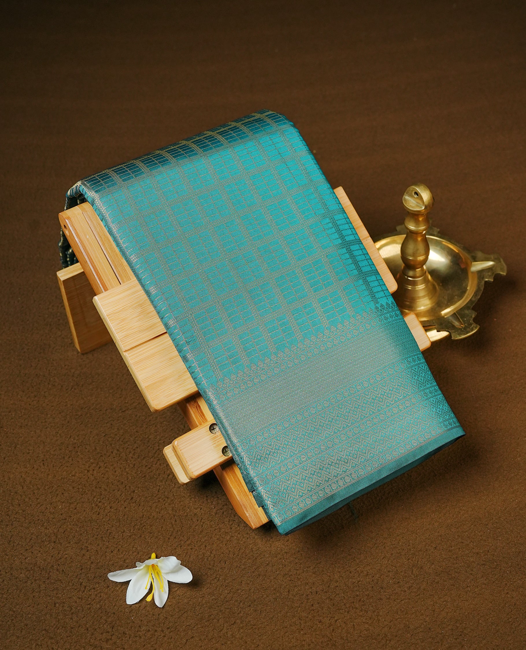 Bottle Green colour Semi Wedding silk saree featuring gold zari Check pattered body, complemented by self colour with traditional border, paired with matching blouse piece.