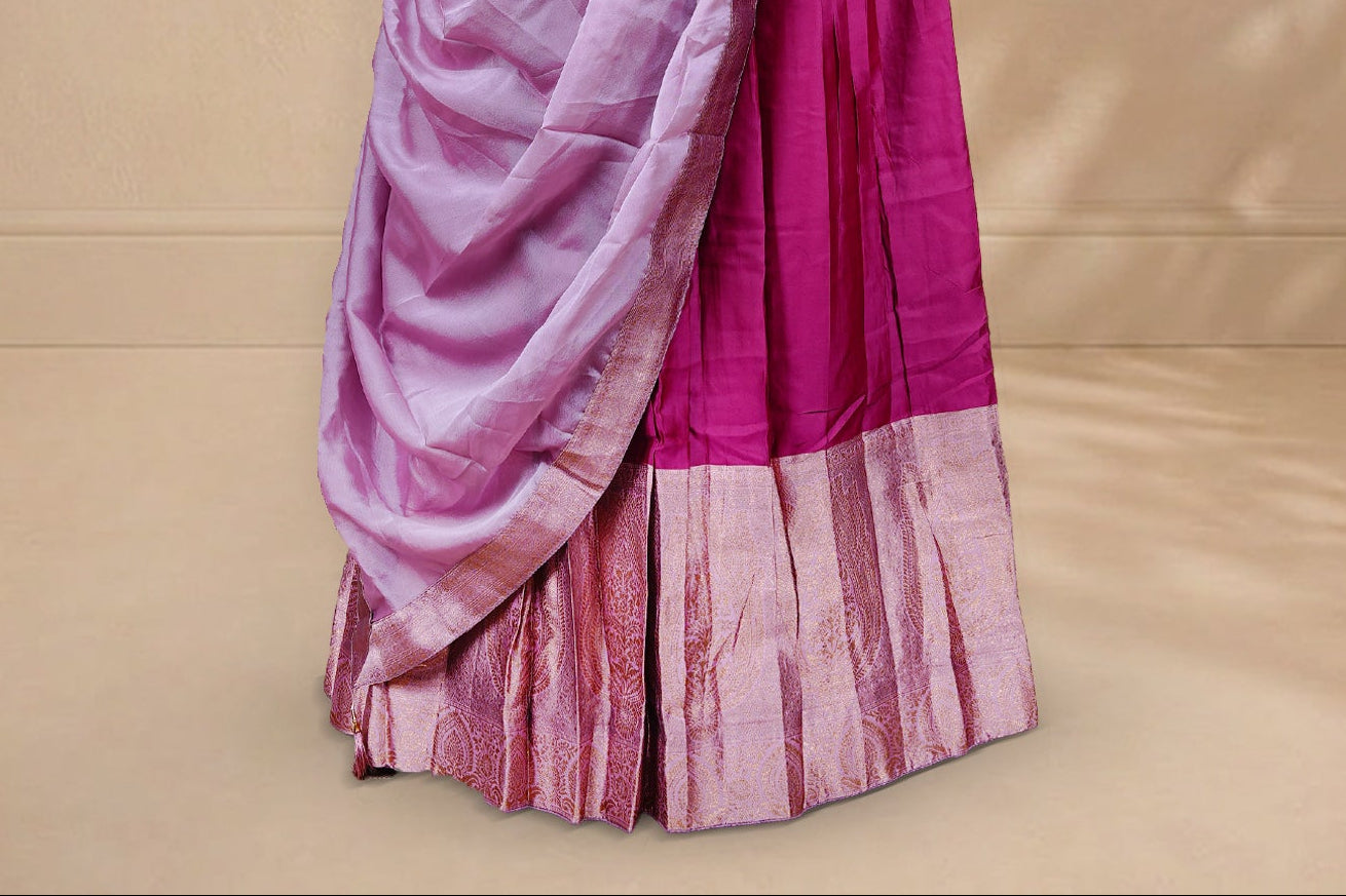Magenta colour Half saree featuring Plain skirt with Zari border on contrast Light pink colour border, Unstitched Blouse and matching dupatta.