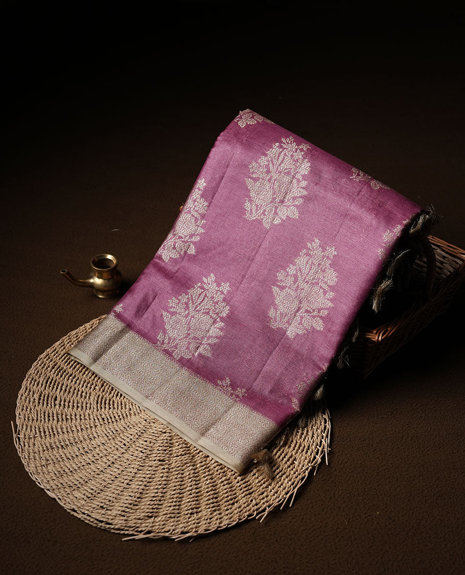 Mauve colour pure banaras tusser silk saree highlighting antique zari pattern across body, with contrast cream colour with zari border and paired with matching blouse