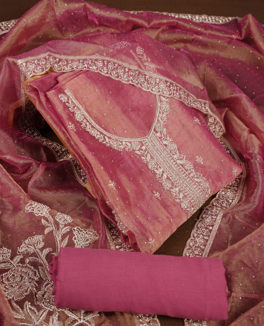 Onion pink colour churidar set with stone and thread embroidery and detailing, paired with matching pant and dupatta.