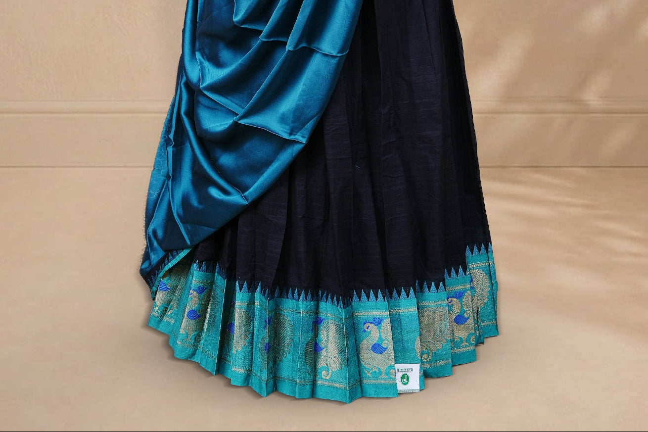 Black colour Half saree featuring Plain skirt with Zari border on contrast Aqua colour border, Unstitched Blouse and matching dupatta.