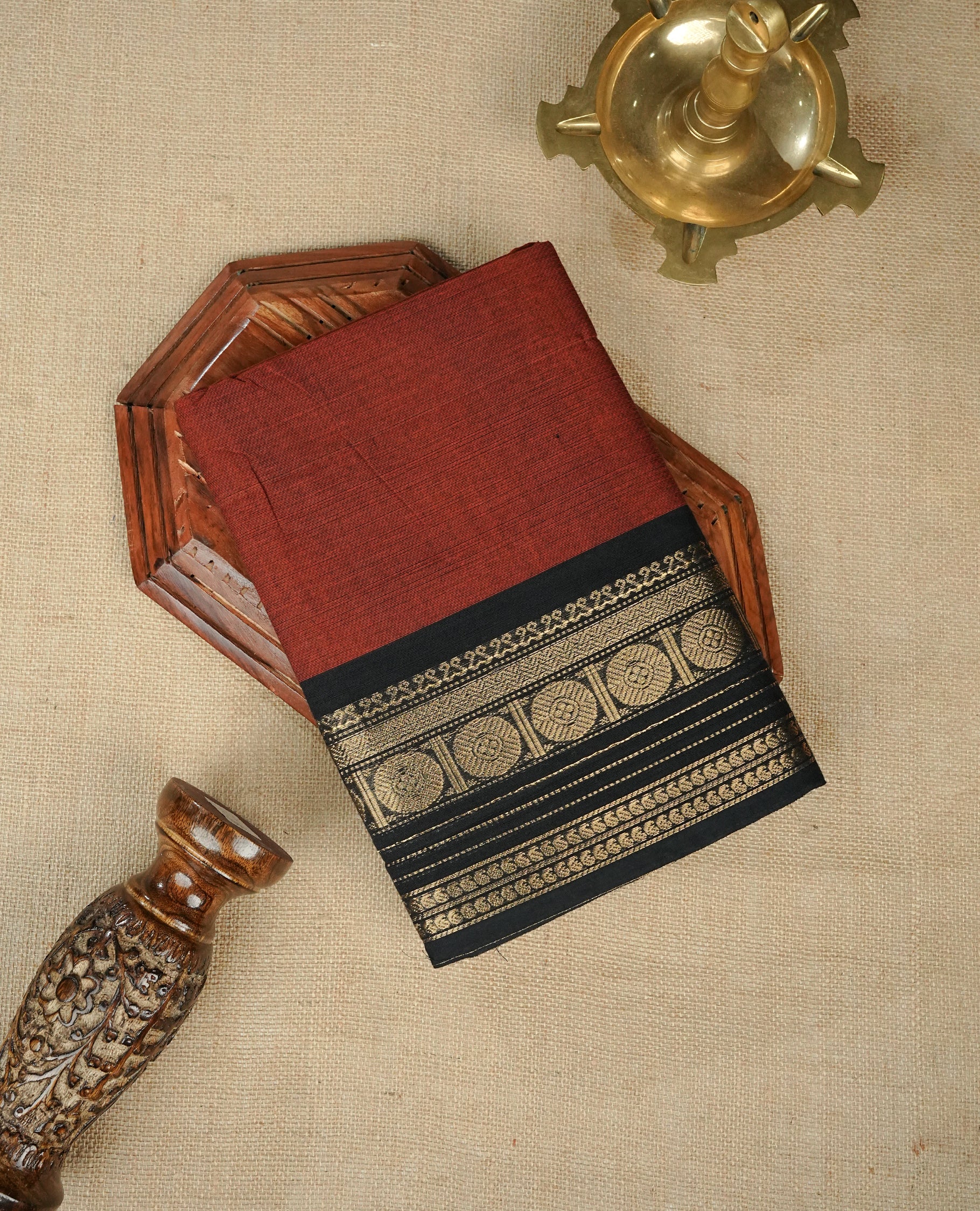 Maroon colour chettinad cotton saree featuring Elegant plain body, complemented by contrast Black colour with gold zari border, comes with matching blouse piece.