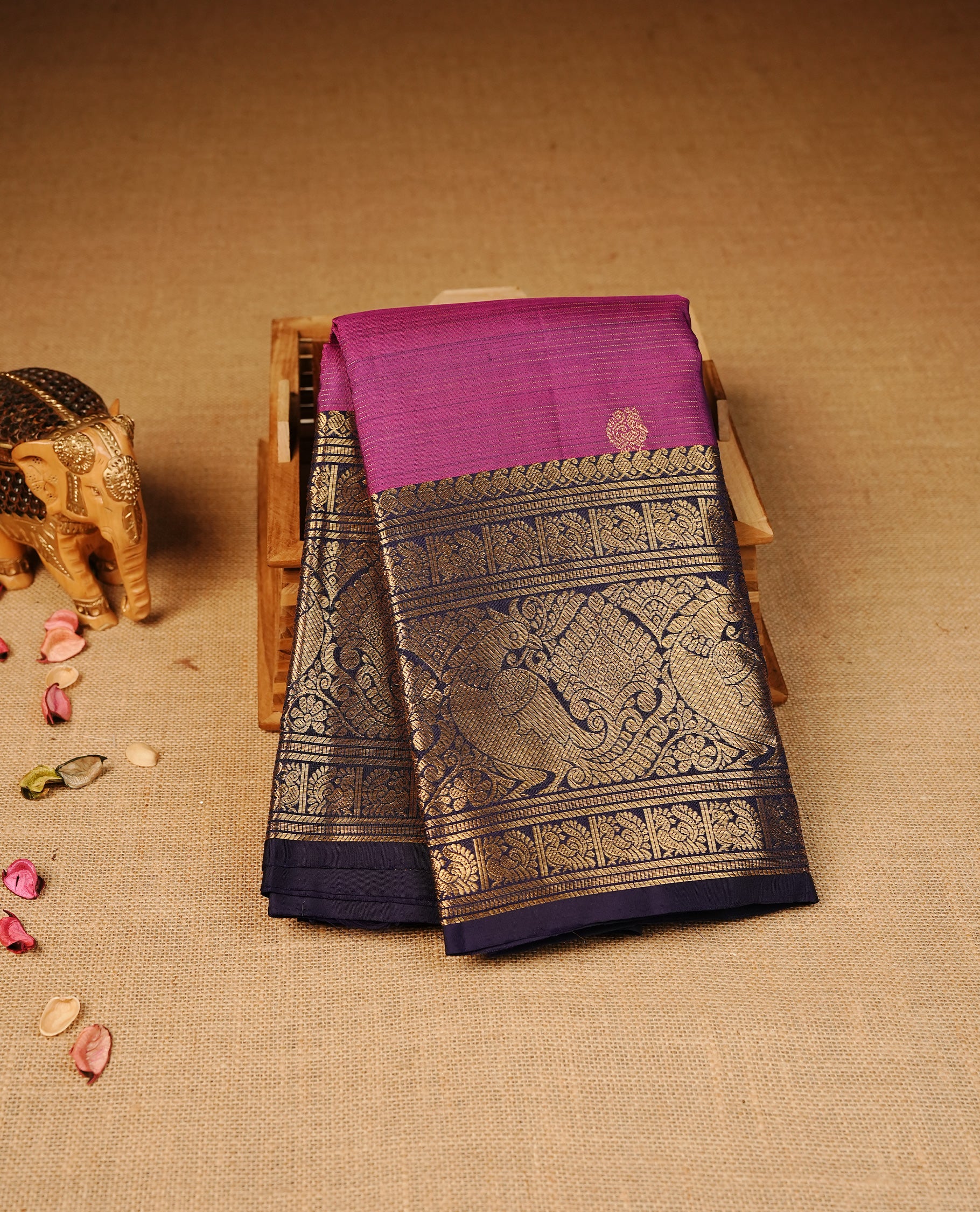 Purple colour Kancheepuram silk saree featuring Gold zari thin Stripes & Motifs on body, Highlighting Violet colour with Gold Zari border, paired with matching blouse piece.