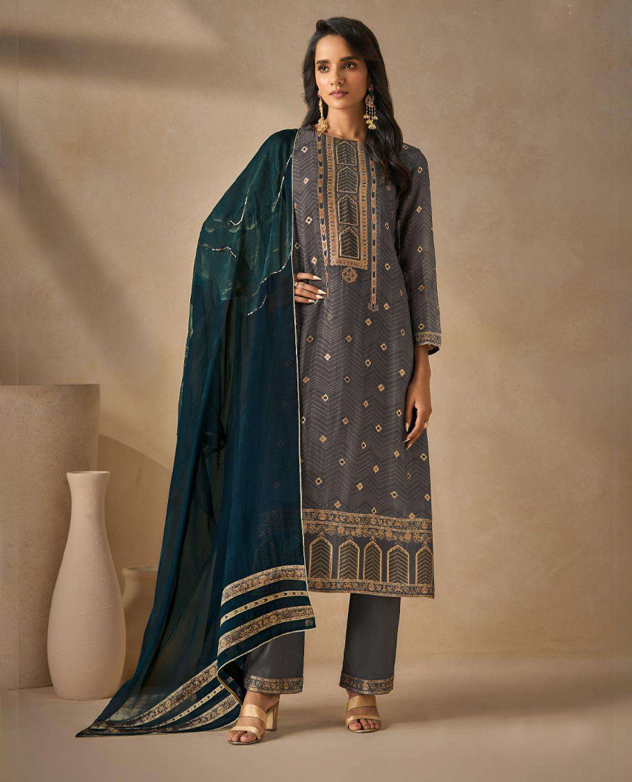 Cool Gray colour suit material with silk jacquard digital print top with embroidery highlighted sleeve work, paired with matching satin bottom and a contrast lightweight printed dupatta.