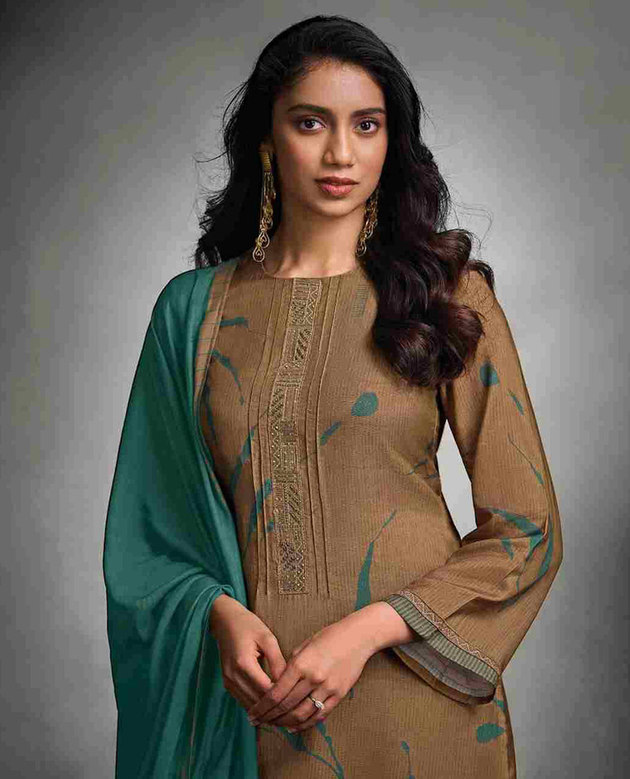 Light brown colour suit material with pakiza silk digital print top with embroidery worked sleeve, paired with matching satin bottom and contrast colour pakiza light weight print with embroidery lace dupatta.