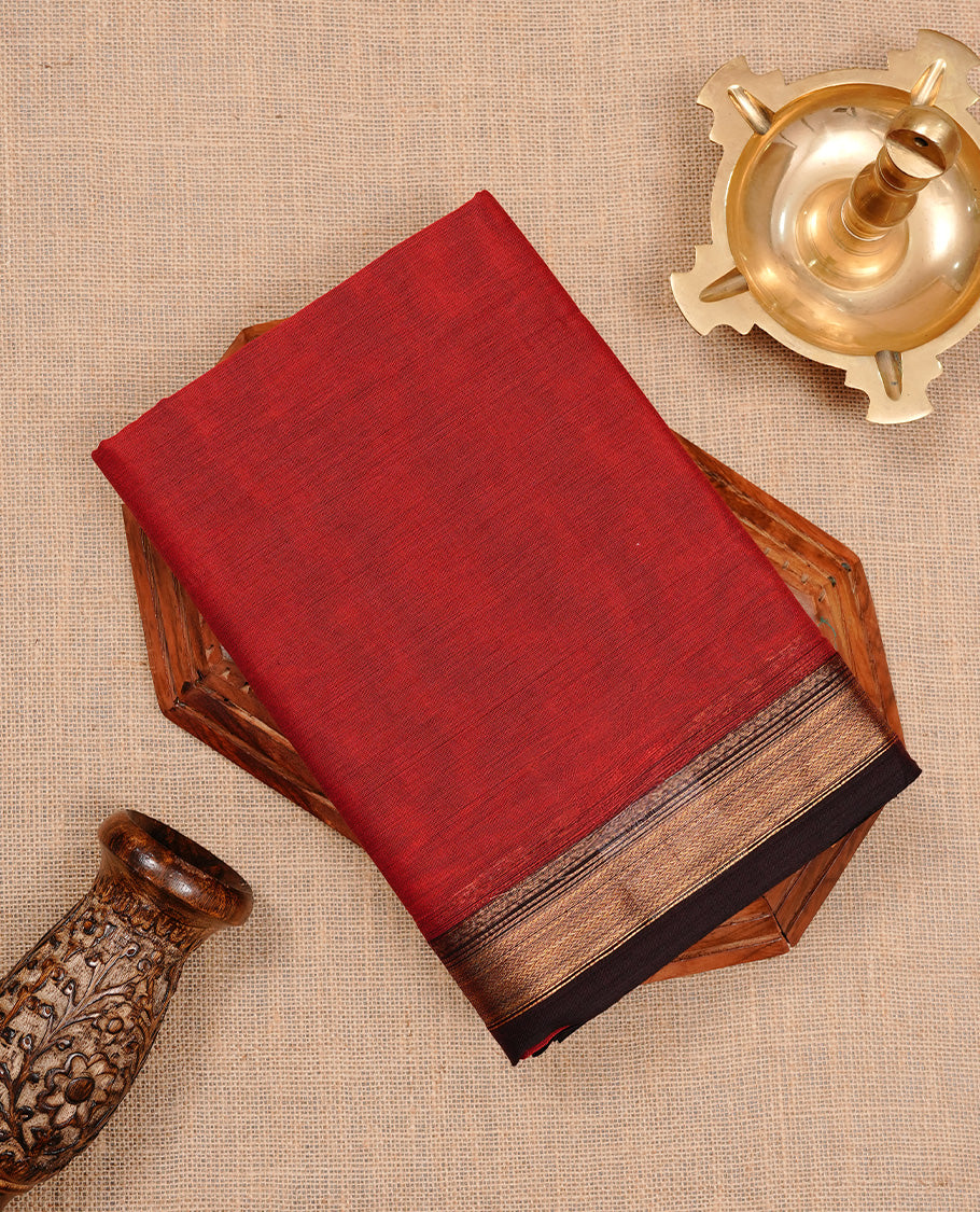 Dark red colour chettinad cotton saree featuring Plain body, complemented by Chocolate with zari border, paired with matching blouse piece.