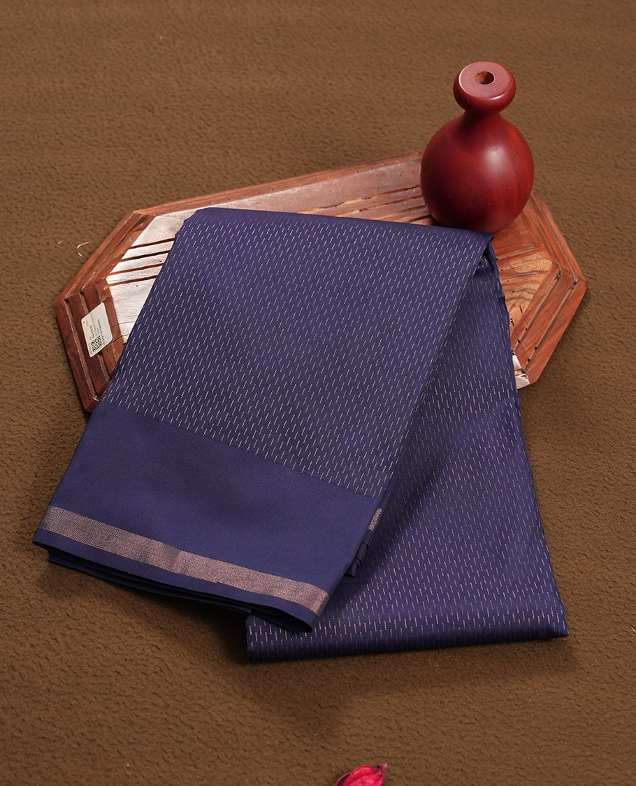 Navy blue colour semi soft silk saree featuring a gold short line patterned body, complemented by pallu & gold border and a matching blouse piece.
