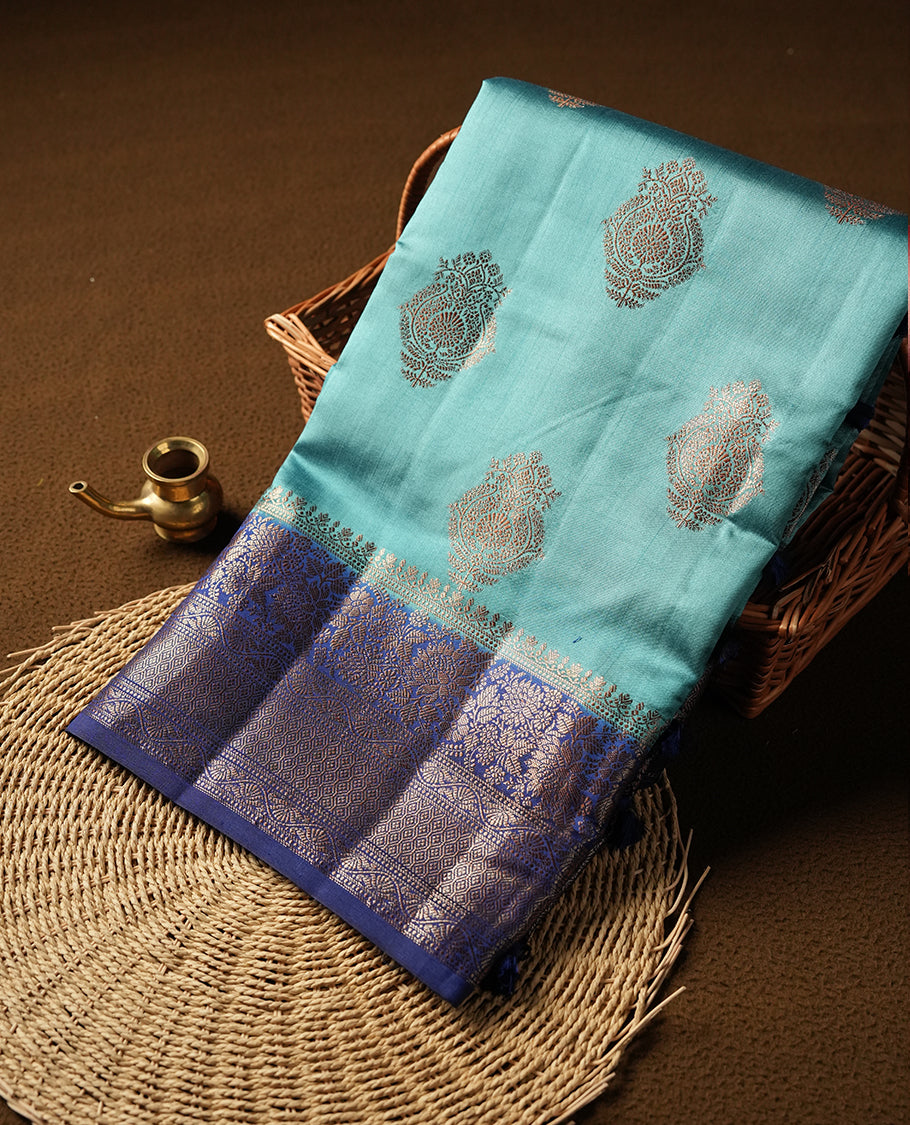 Aqua blue Banaras soft silk saree with gold zari motifs on body, with contrast Dark blue colour floral pattern on pallu, border, and Matching blouse.